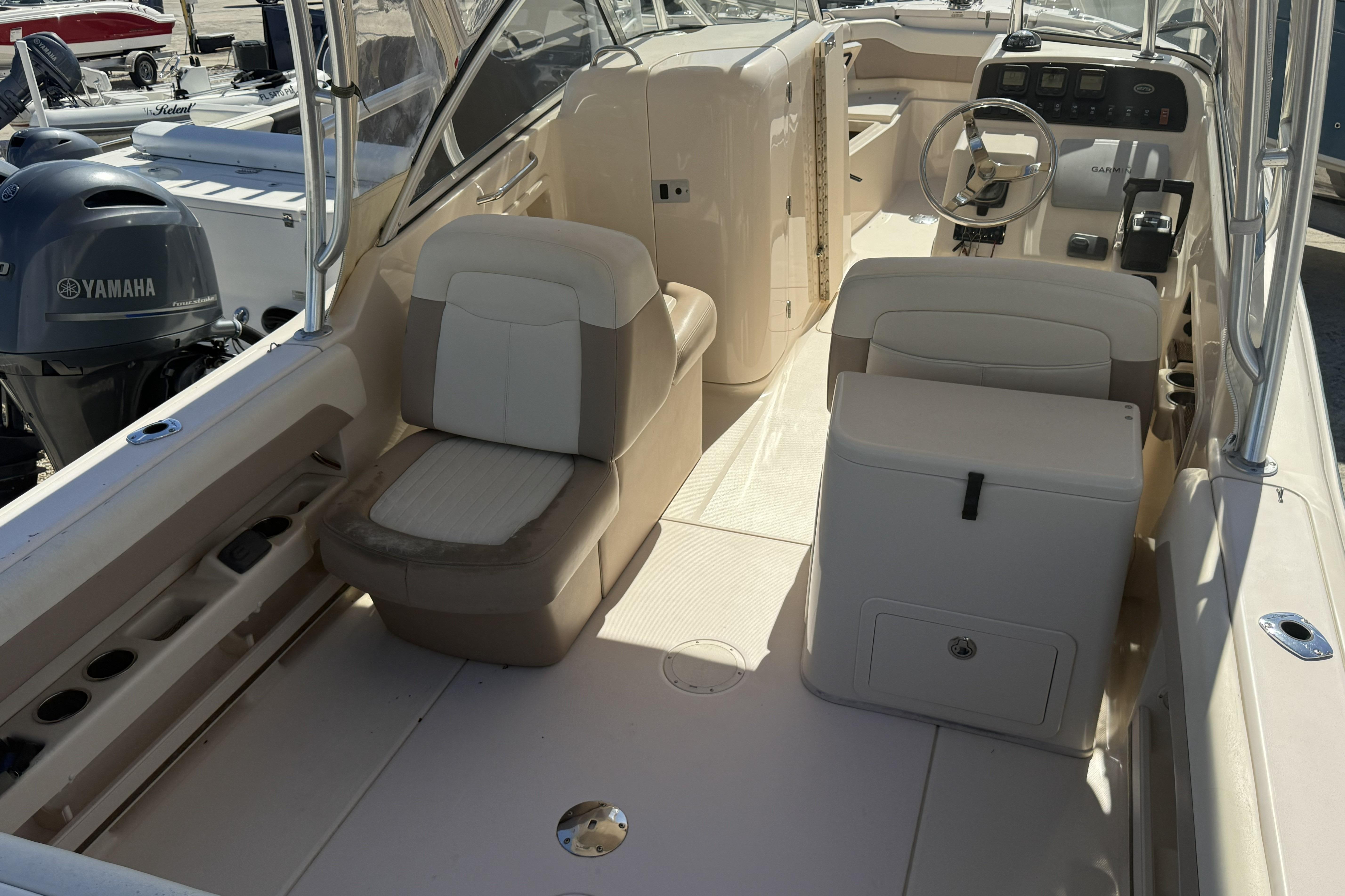 2014 Grady-White Freedom 275 boat interior with seating and Yamaha engine.