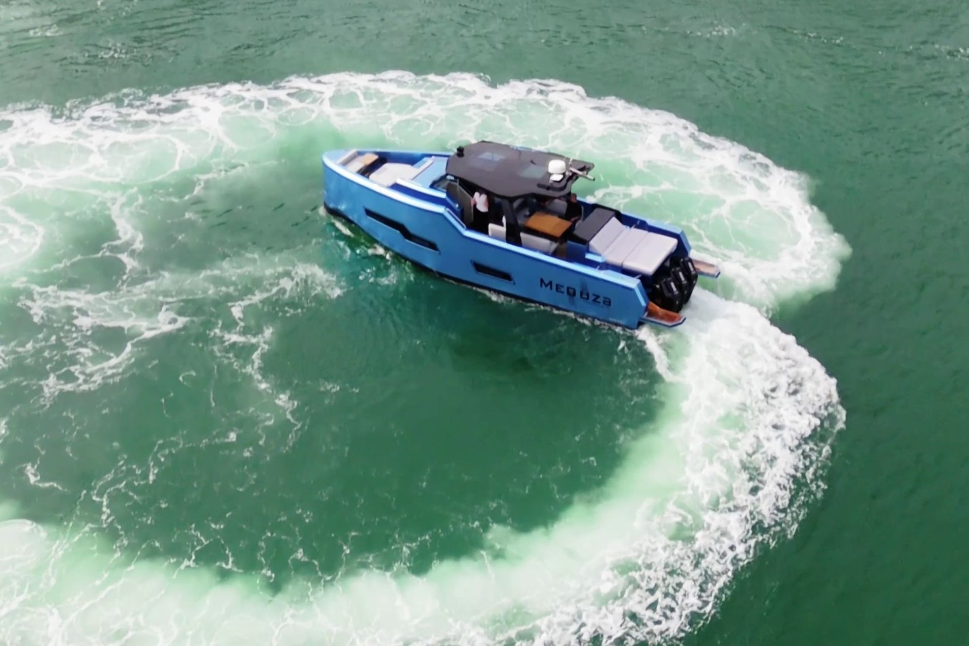 Fabbro F45 Cabrio Outboard 2025 spinning in water, featuring a blue hull and open deck.