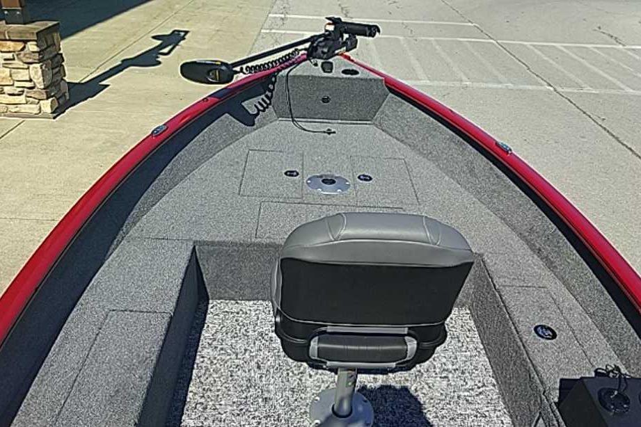 2026 Tracker Super Guide V-16 T boat interior with gray seating and red trim.