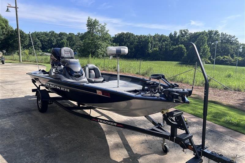 2021 Tracker Pro Team 175 TXW boat on trailer, parked outdoors.