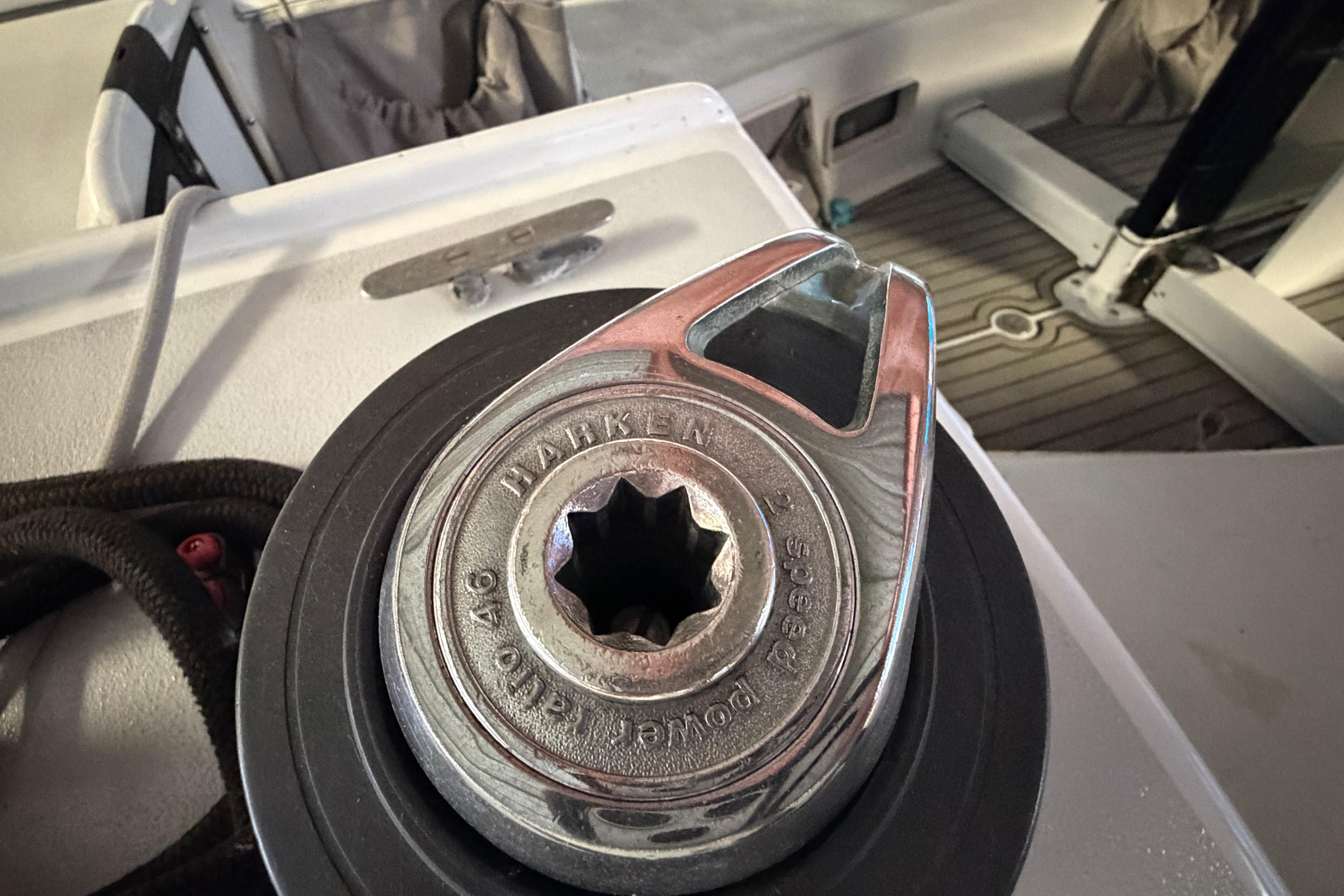 Close-up of a Harken winch on an Andrews 63 sailboat deck.