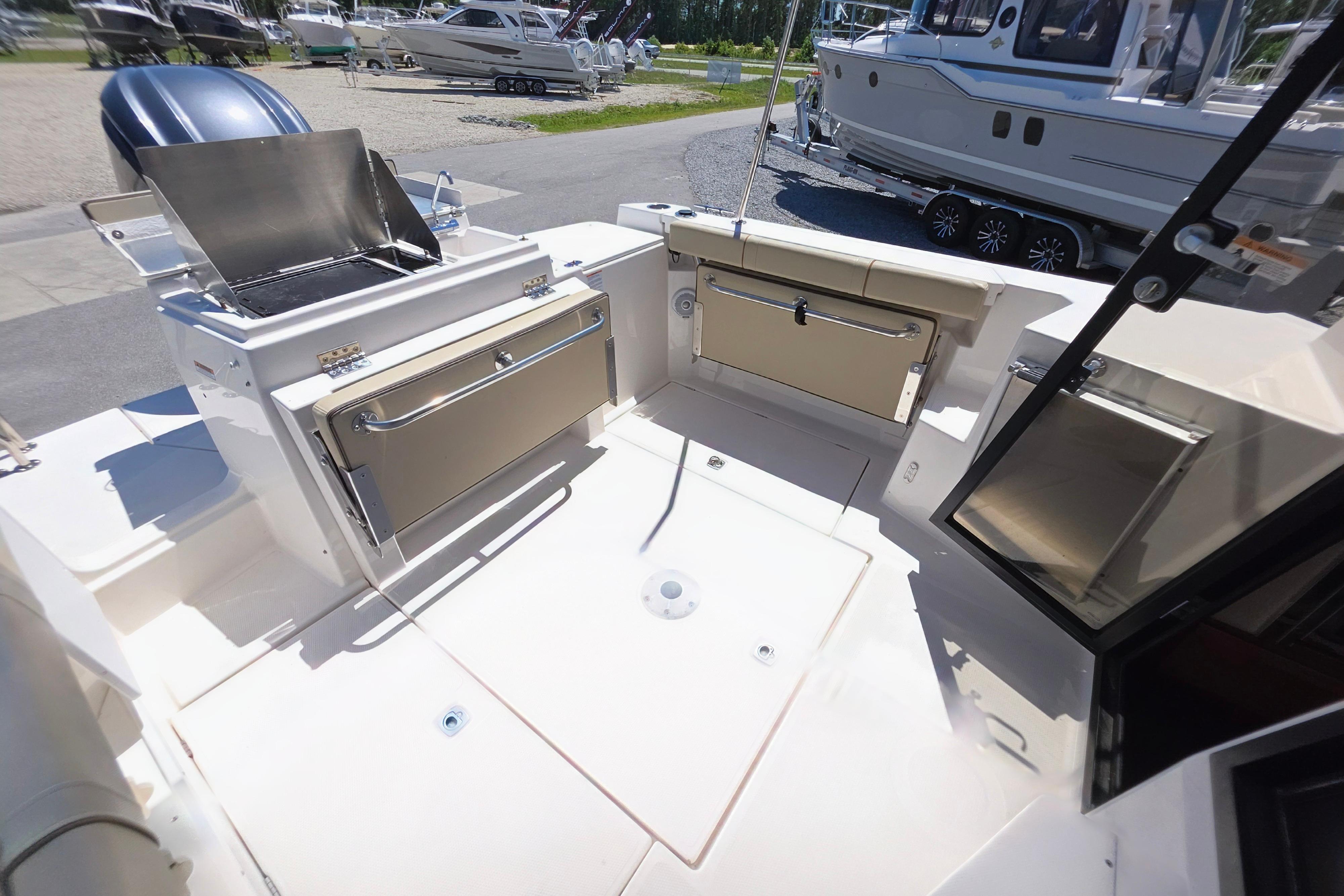 2021 Ranger Tug R27 boat deck with grill and storage compartments.