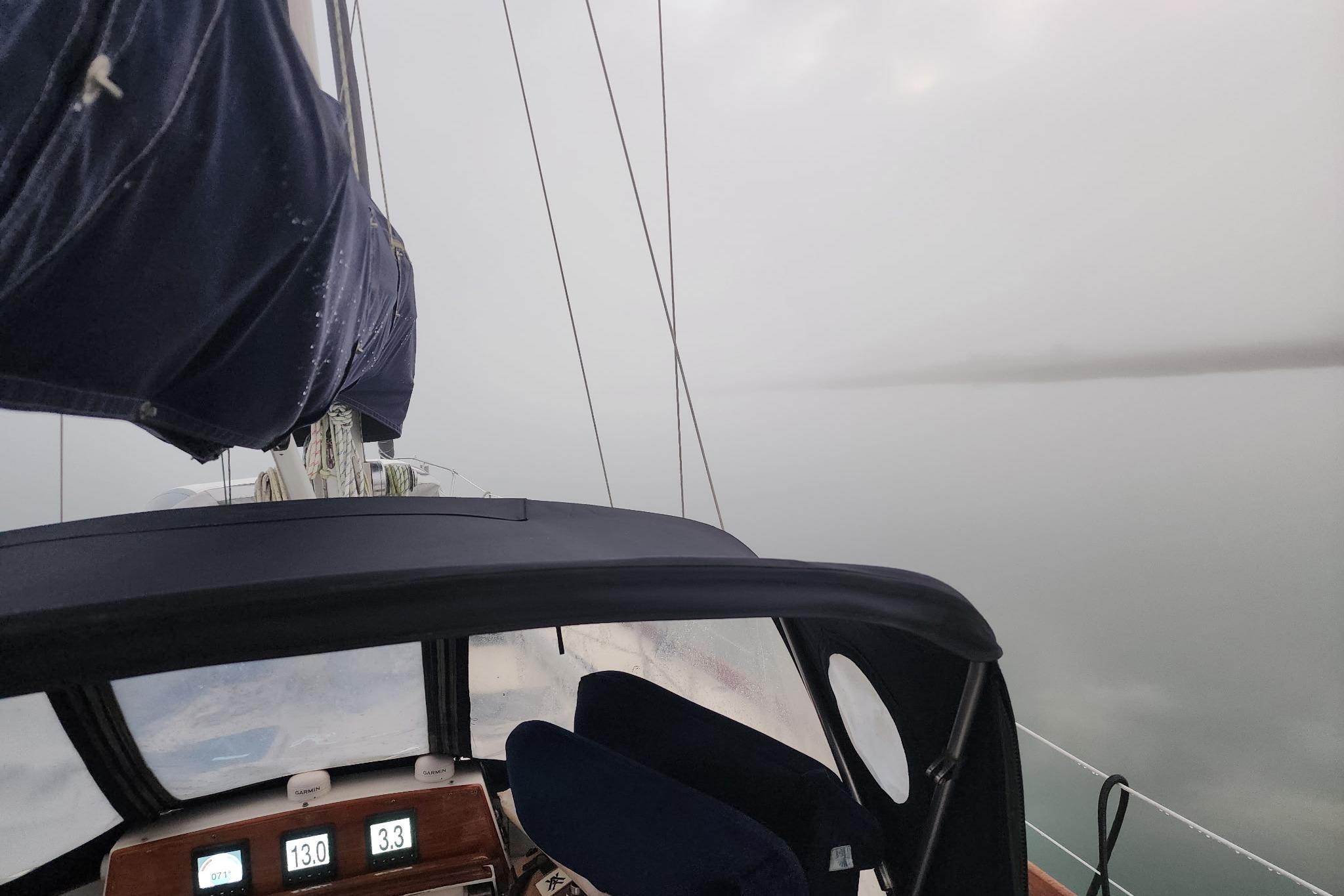 1984 Bristol 45.5 Center Cockpit sailboat navigating in foggy waters.