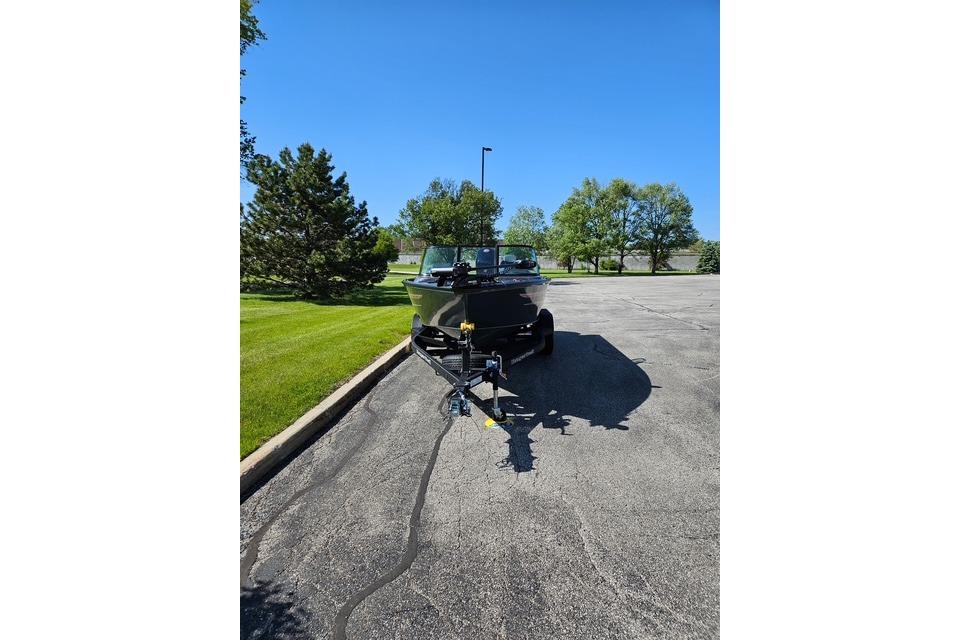 2026 Ranger VS1882SC Angler boat on trailer in sunny parking lot.