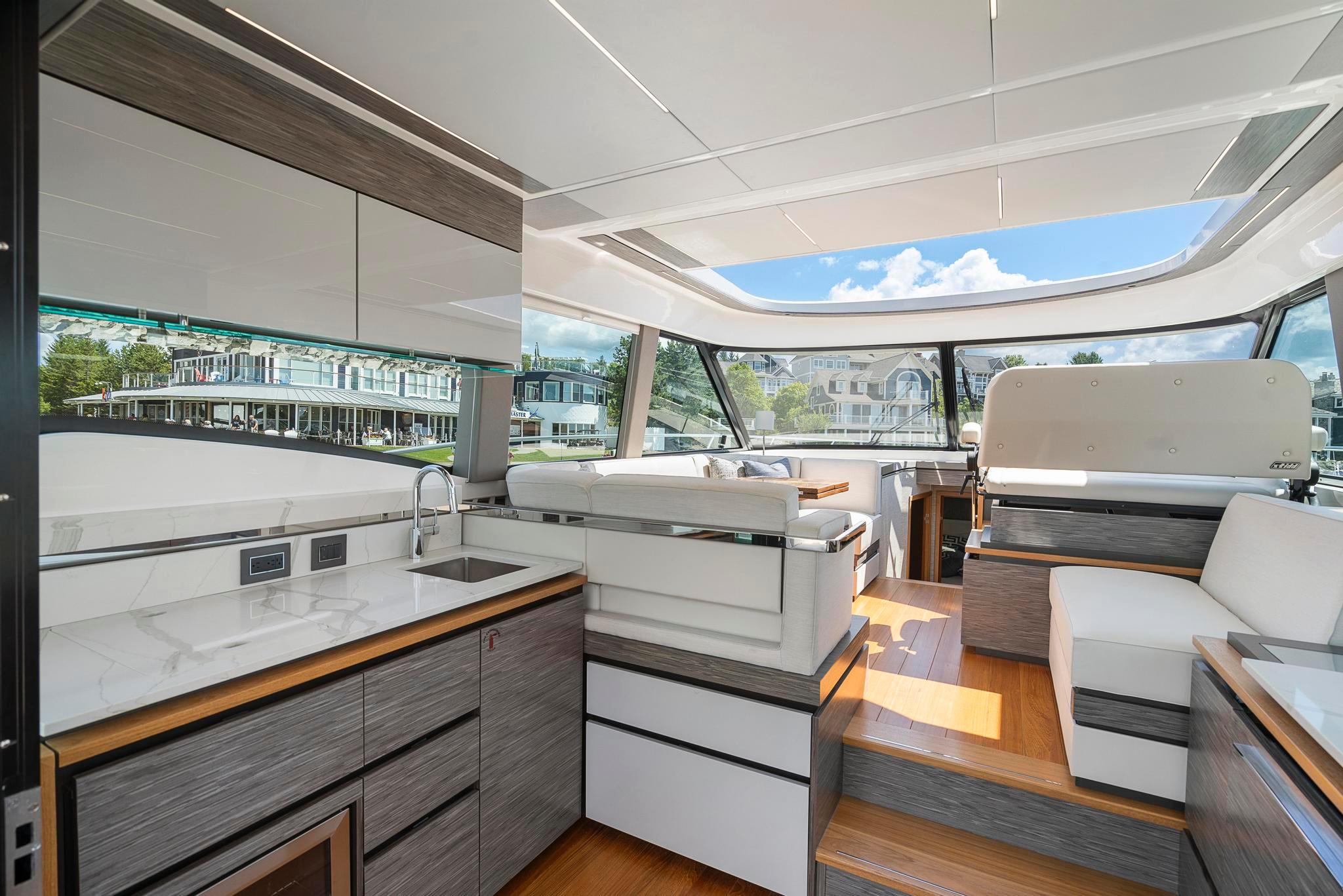2022 Tiara Yachts C49 Coupe interior with modern design and panoramic windows.