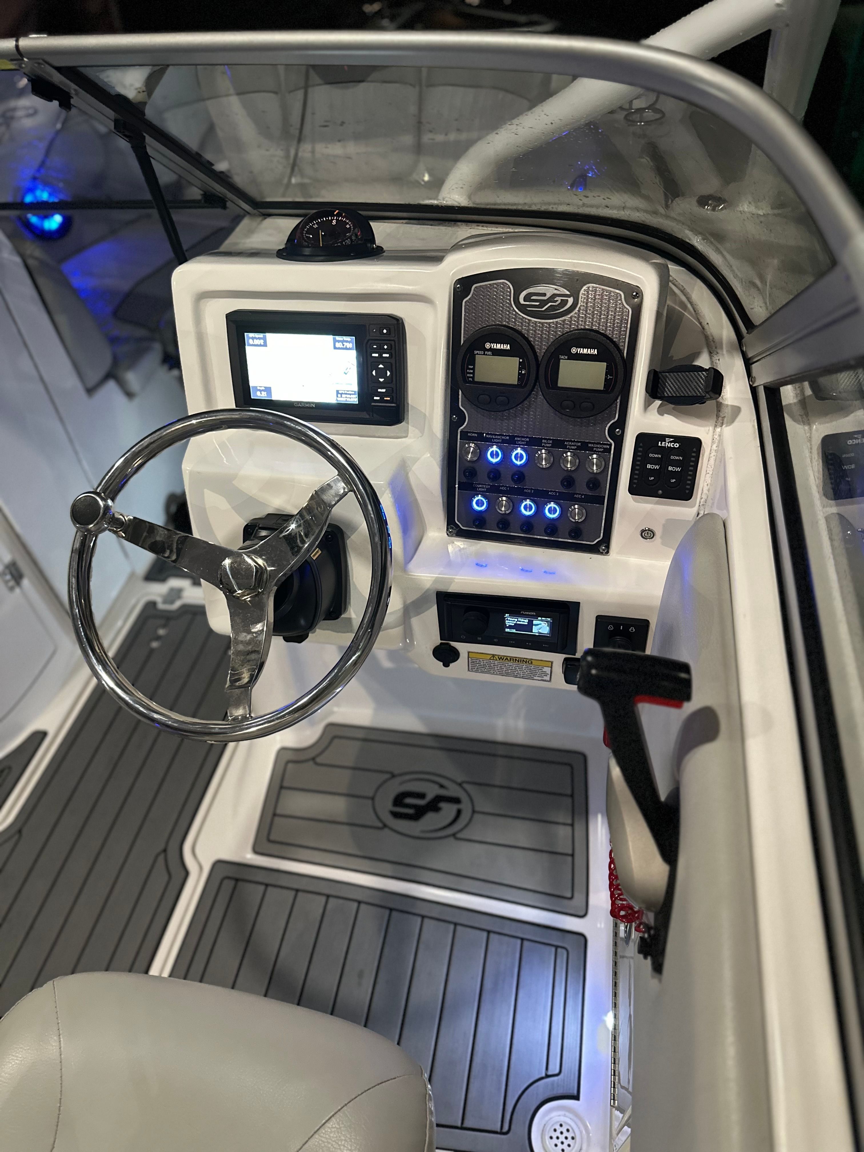 2021 Sea Fox 226 Traveler cockpit with steering and instruments.
