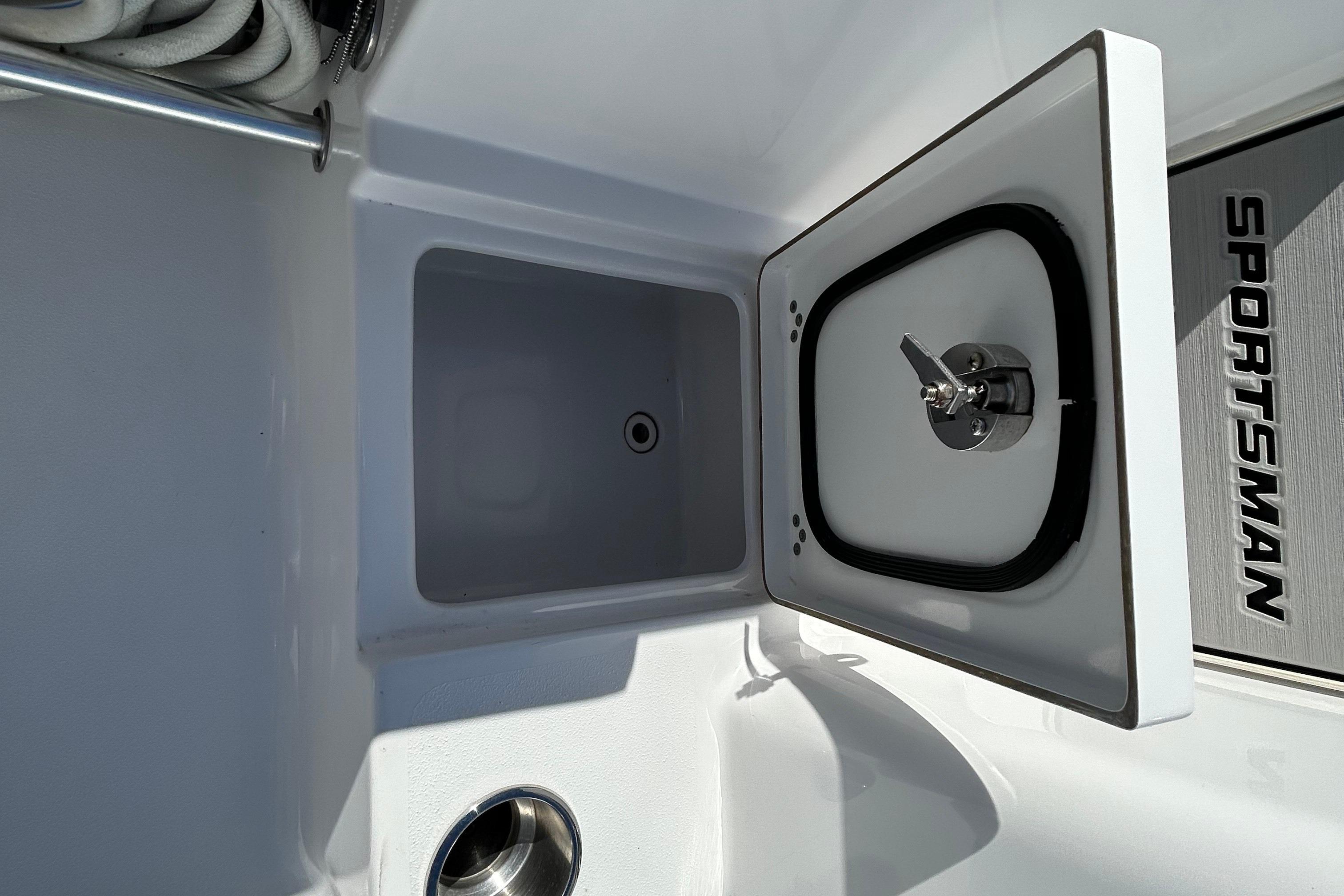 2019 Sportsman Open 282 Center Console boat storage compartment with open lid.