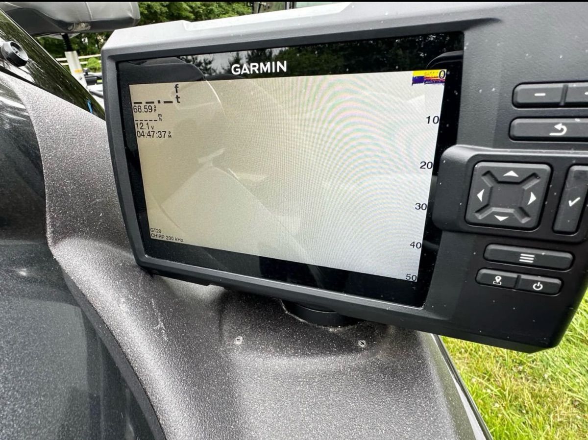 A Garmin fishfinder is mounted on a Bass Tracker 195TXW boat.