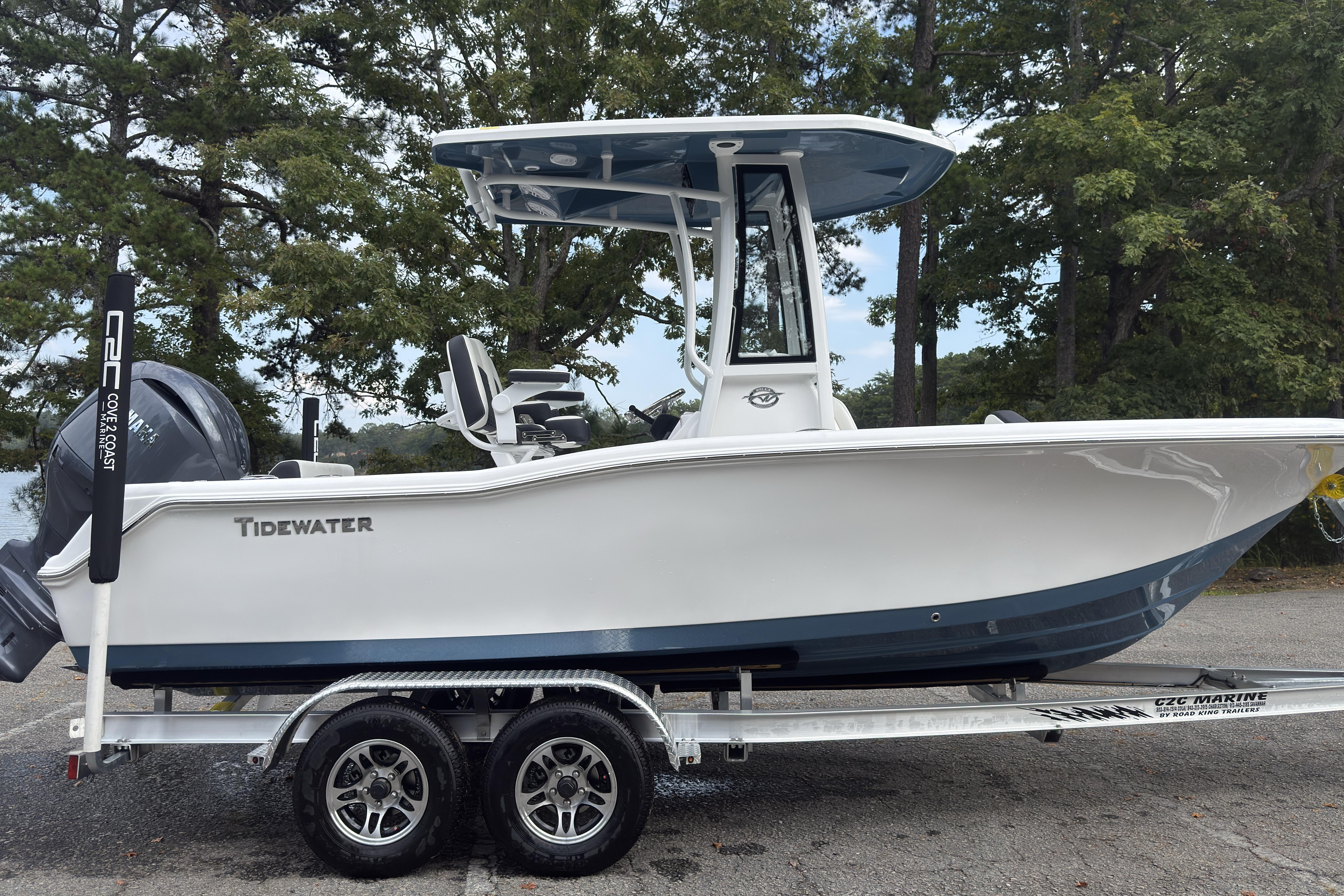 2026 Tidewater 210 CC Adventure boat on trailer, parked outdoors.