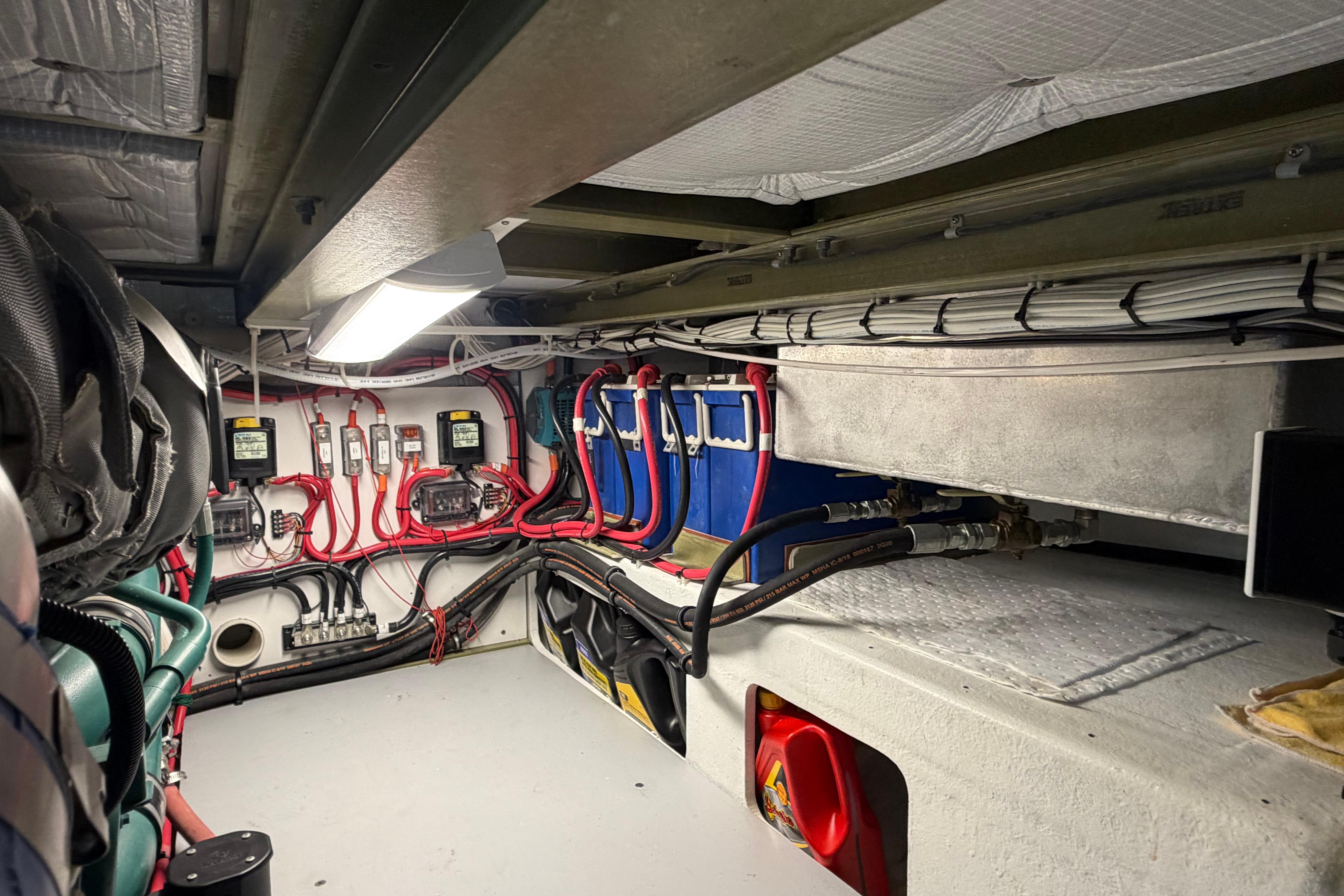 Engine room of 2018 H&H Marine Osmond Beal boat, featuring wiring and equipment.