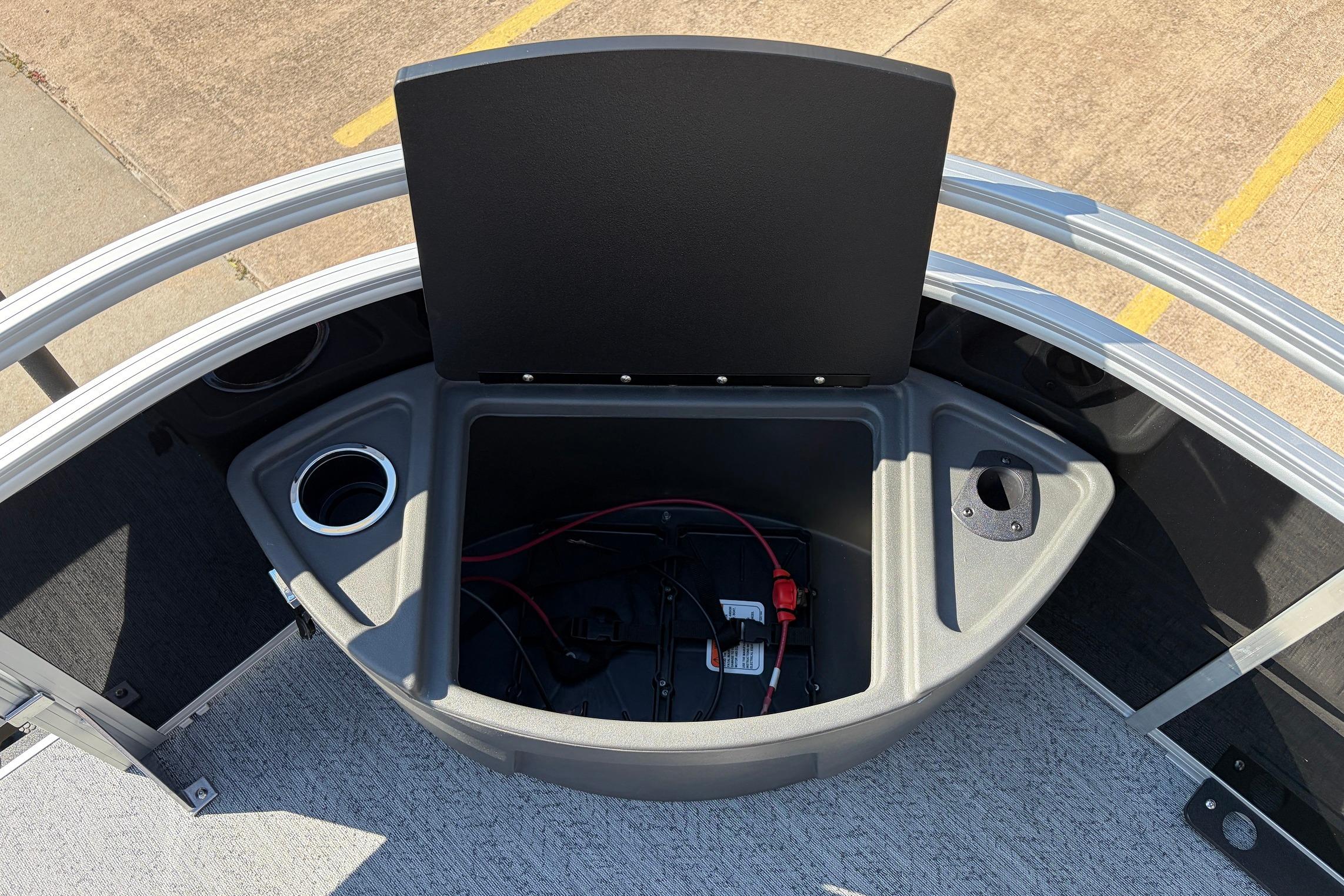 2026 Sun Tracker Fishin' Barge 22 XP3 storage compartment with cup holders and wiring.