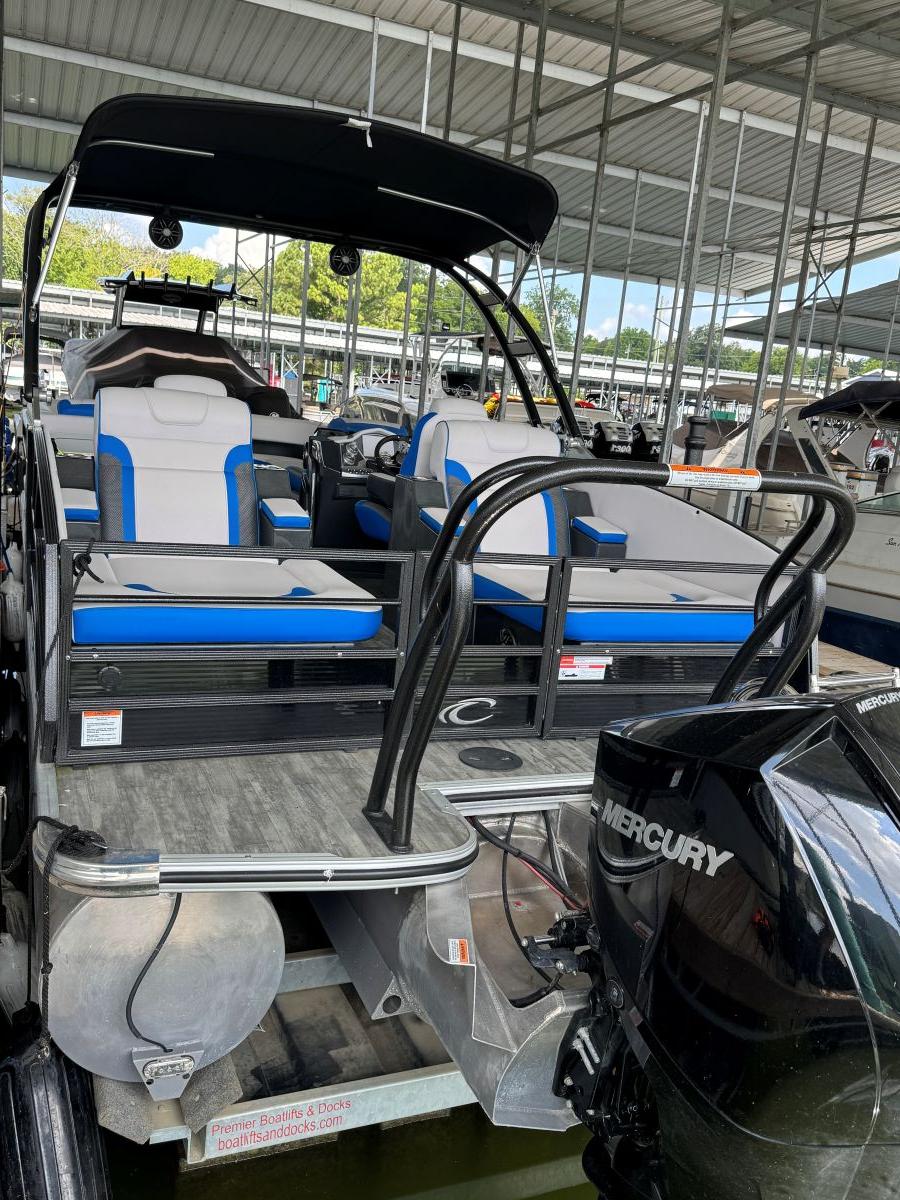 2022 Crest Caribbean RS 250 SLRC pontoon boat with Mercury engine at dock.
