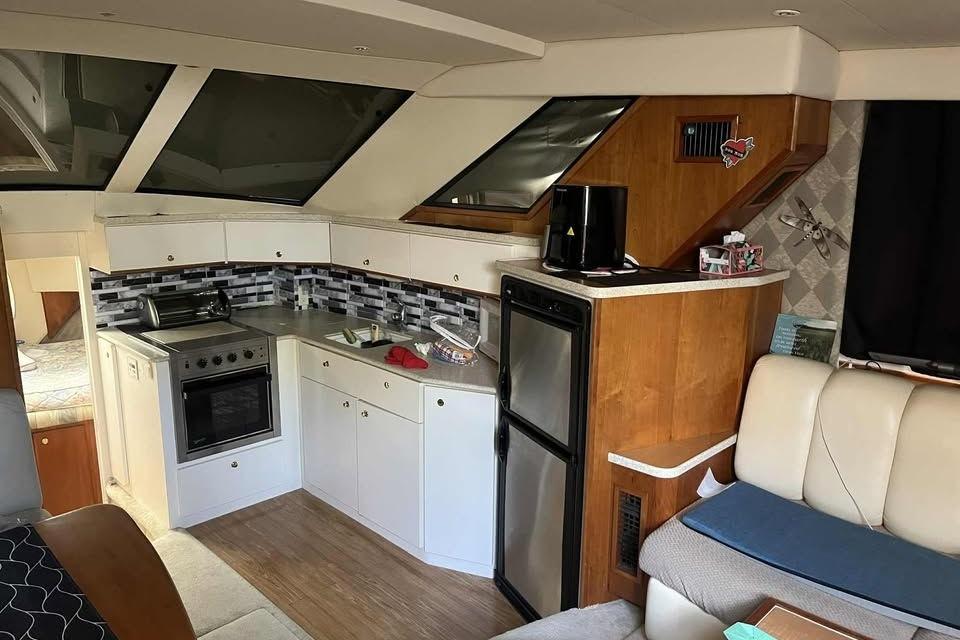 Interior of 1999 Silverton 392 Motor Yacht with kitchen and seating area.