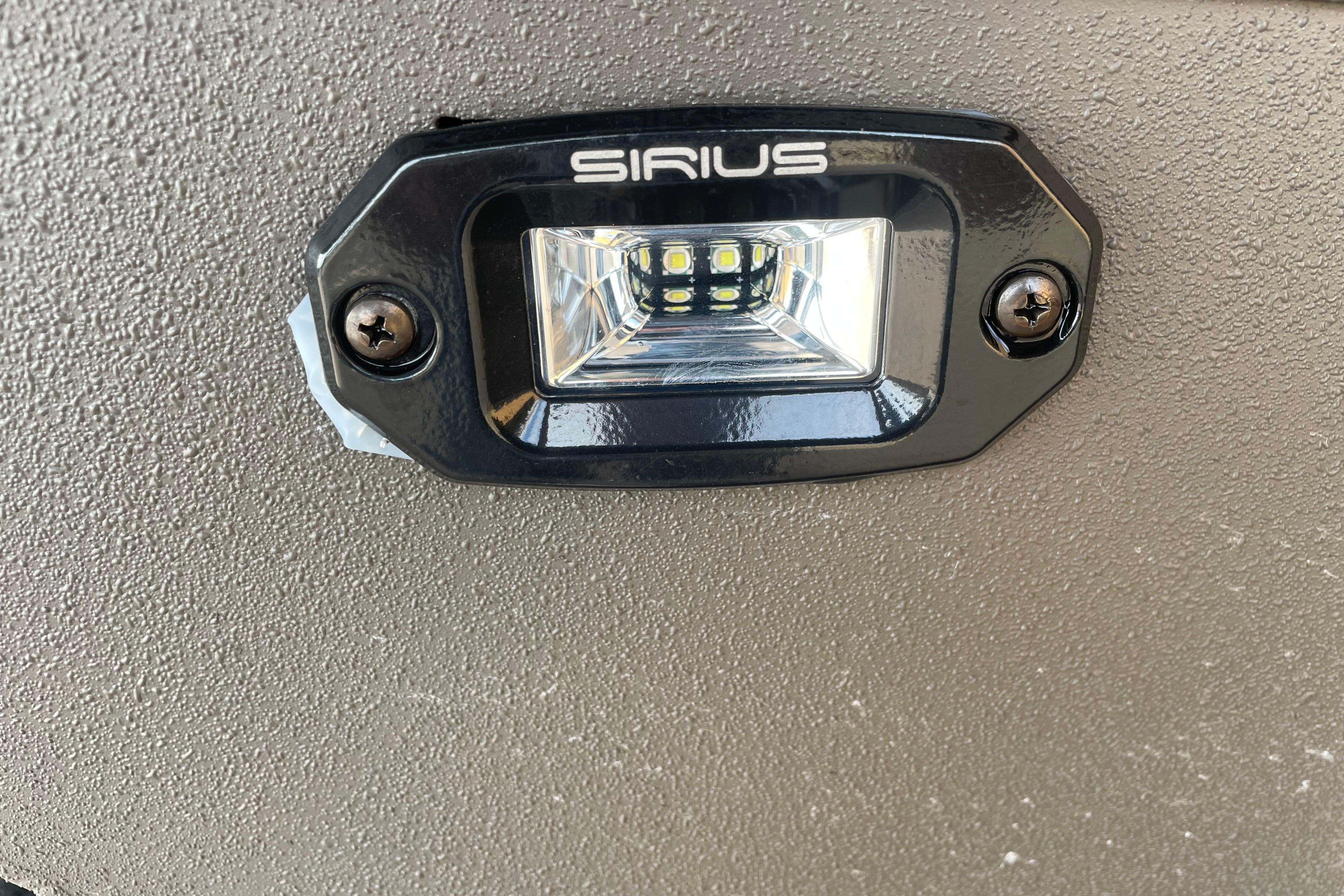 LED light fixture on 2026 Reaper Boats 753 Timber Reaper, featuring Sirius branding.