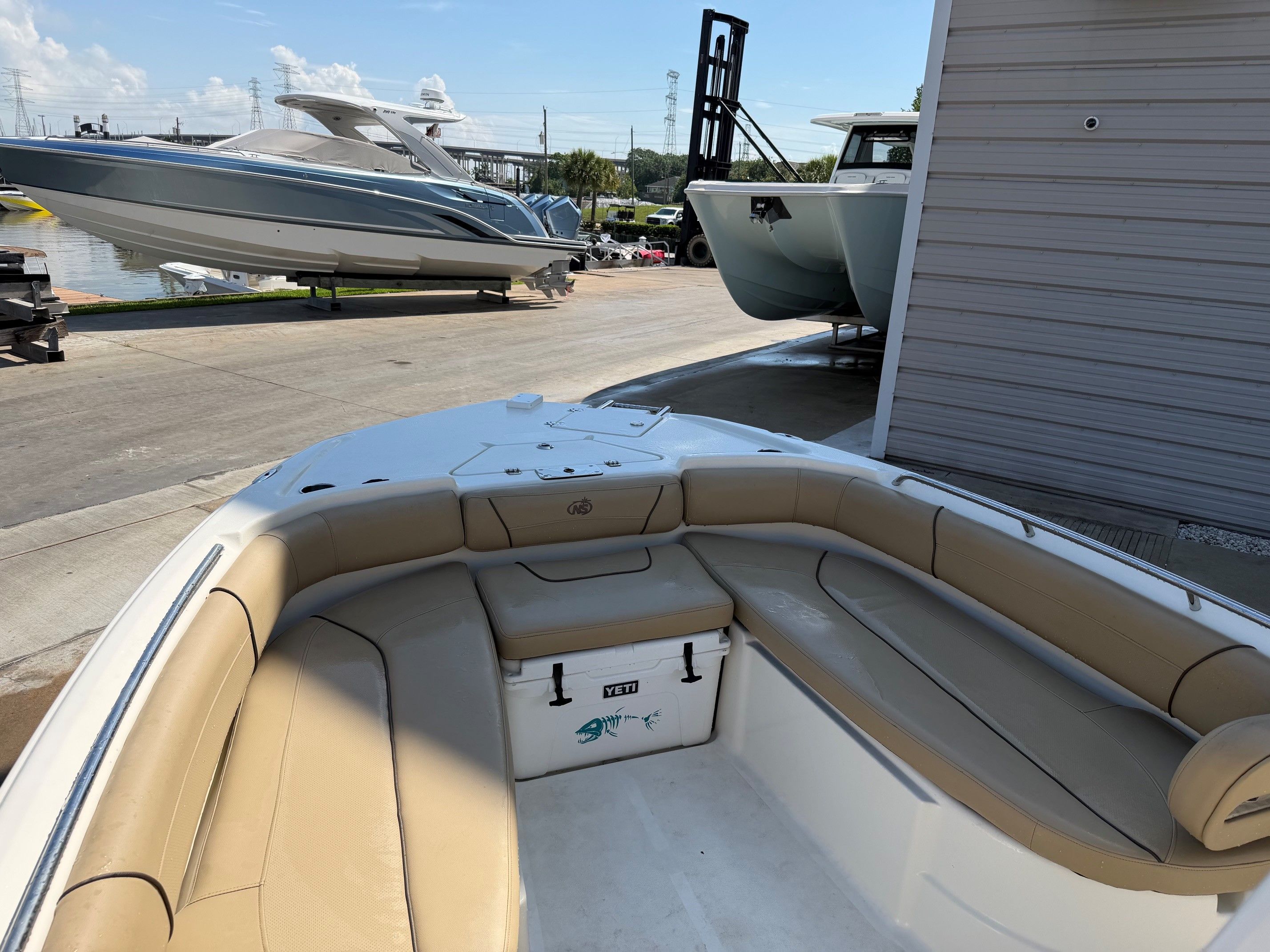 Interior view of a 2019 NauticStar 251 Hybrid boat at the dock.
