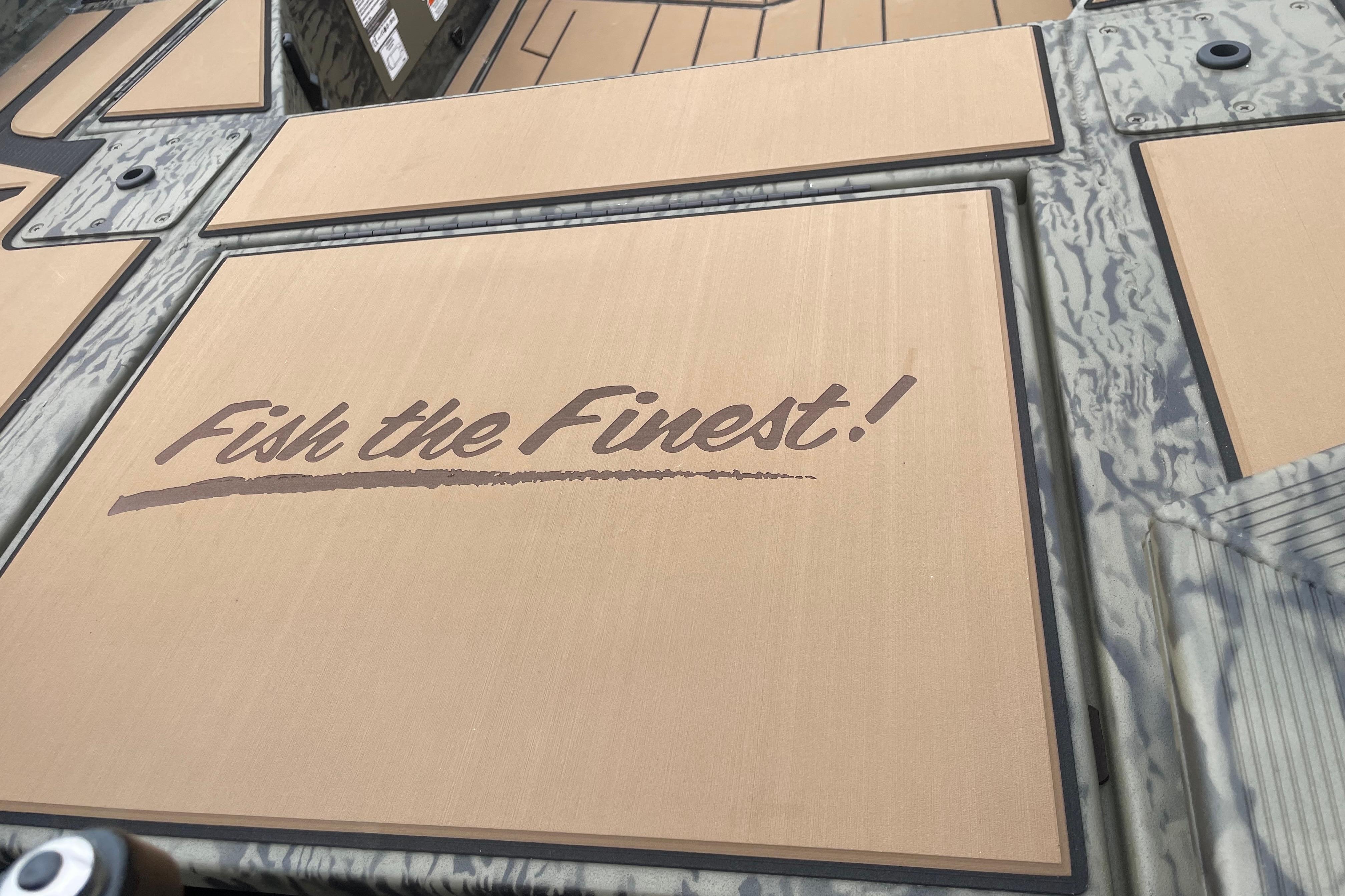 2026 Tracker Grizzly 1756 T Marsh boat deck with "Fish the Finest!" slogan.