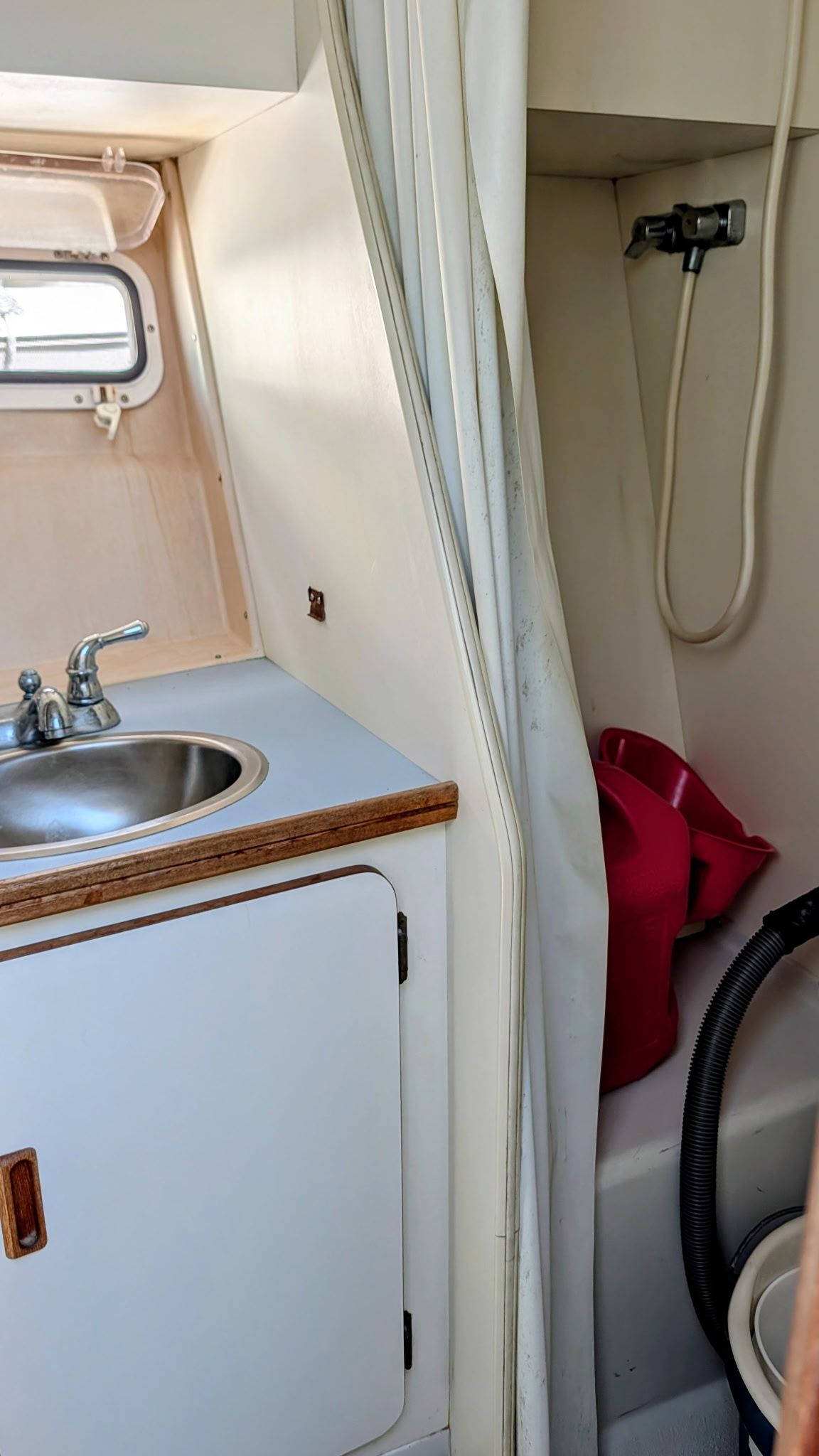 The image shows the bathroom of a 1987 Chris-Craft 320 Amerosport Express with a sink and shower.