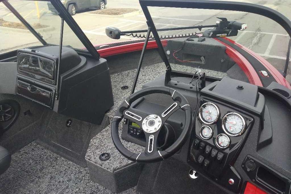 Interior view of 2026 Tracker Targa V-18 WT boat dashboard with steering wheel and gauges.
