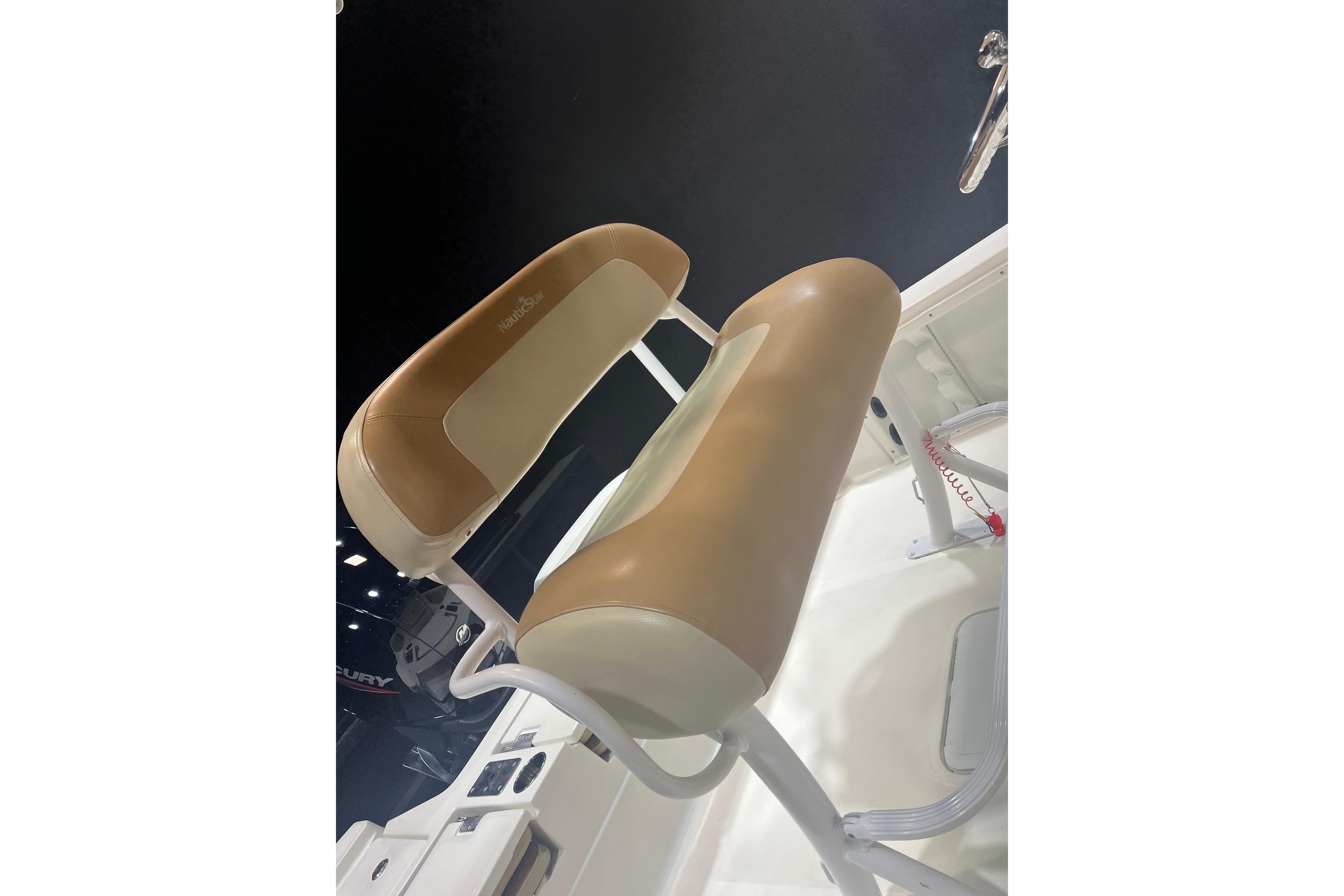 2023 NauticStar 227 XTS boat seat with tan and white upholstery.