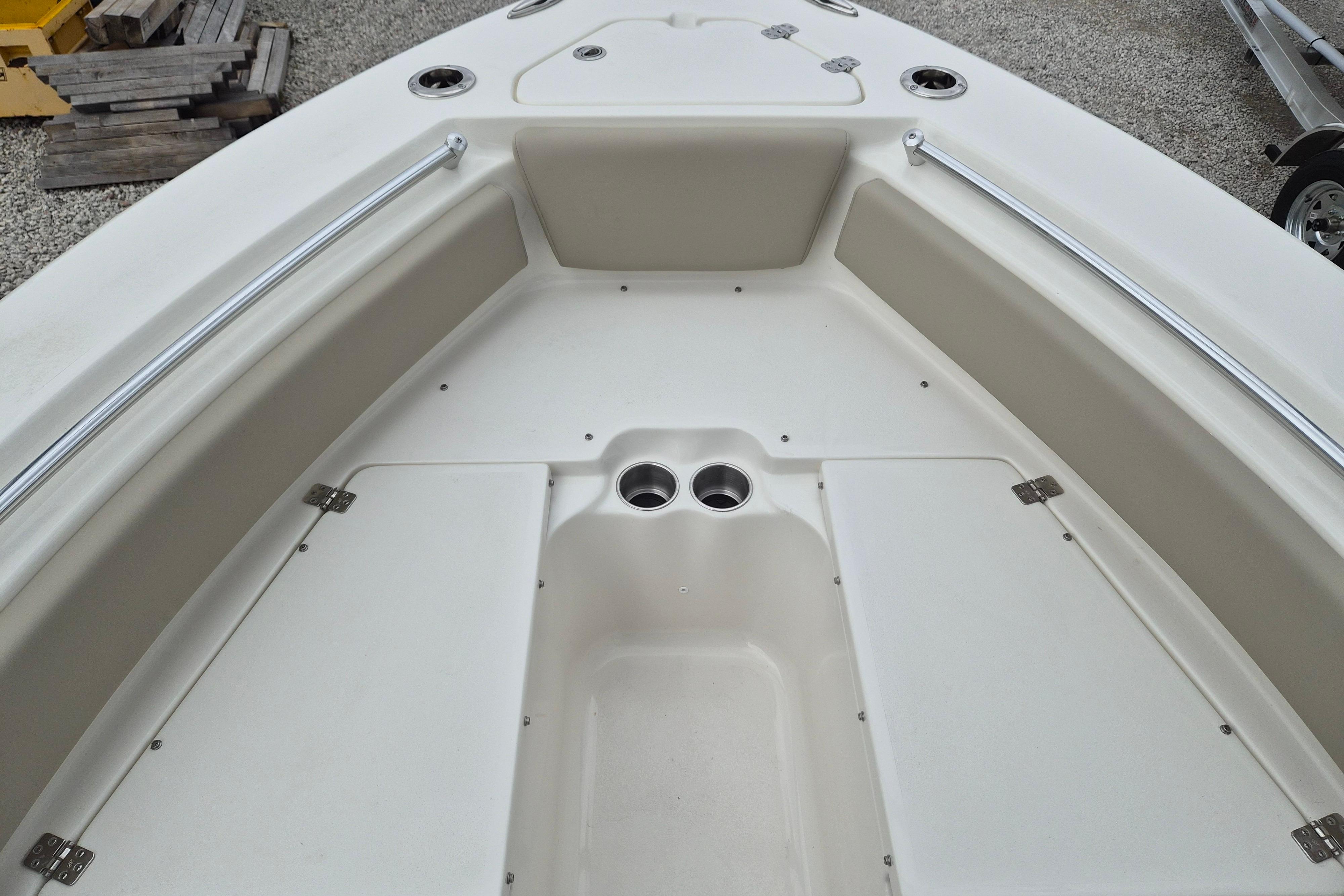 2026 Key West 219 FS boat interior with storage compartments and cup holders.