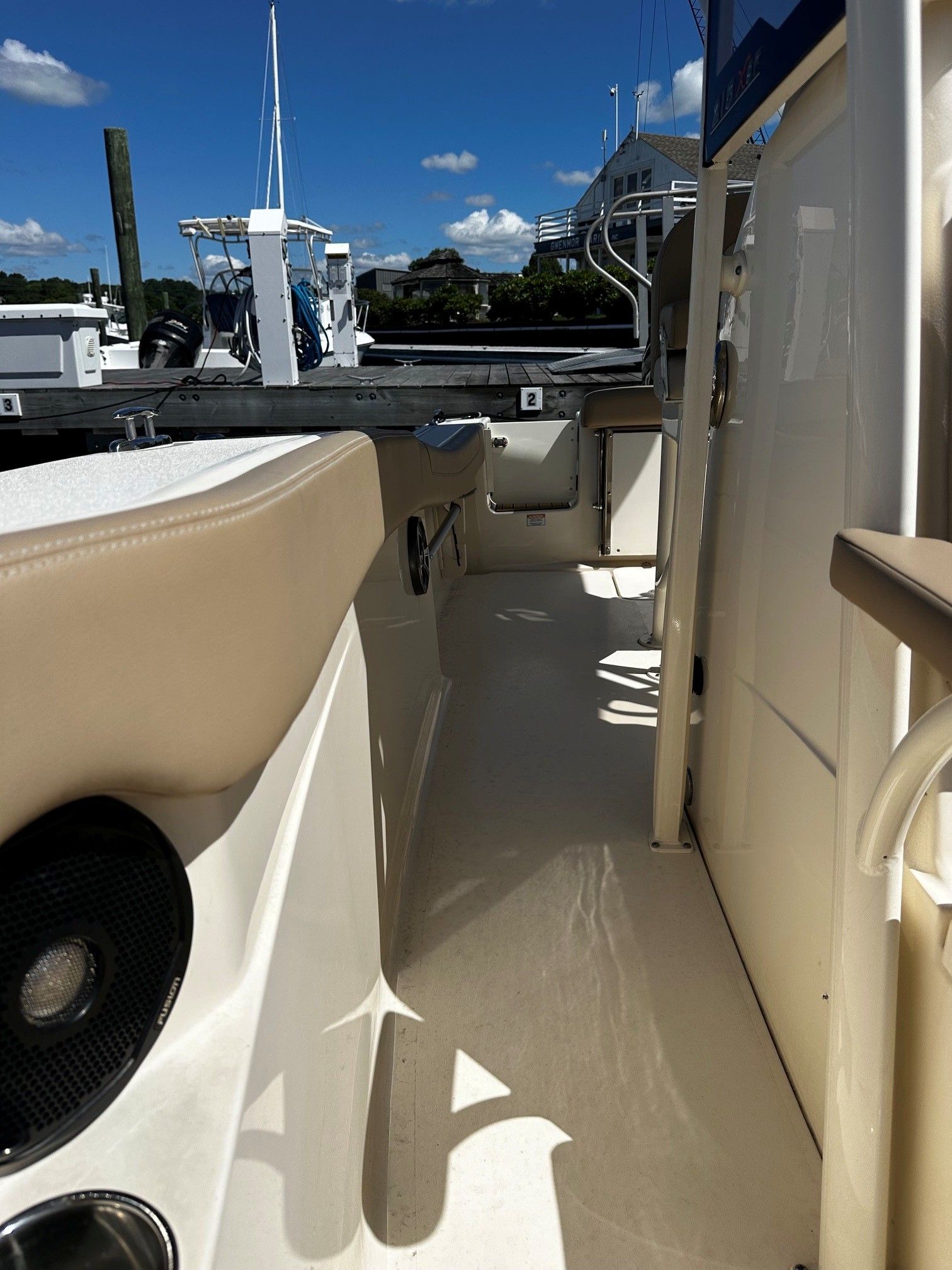 Scout 210XSF 2022 boat dock view in sunny weather.