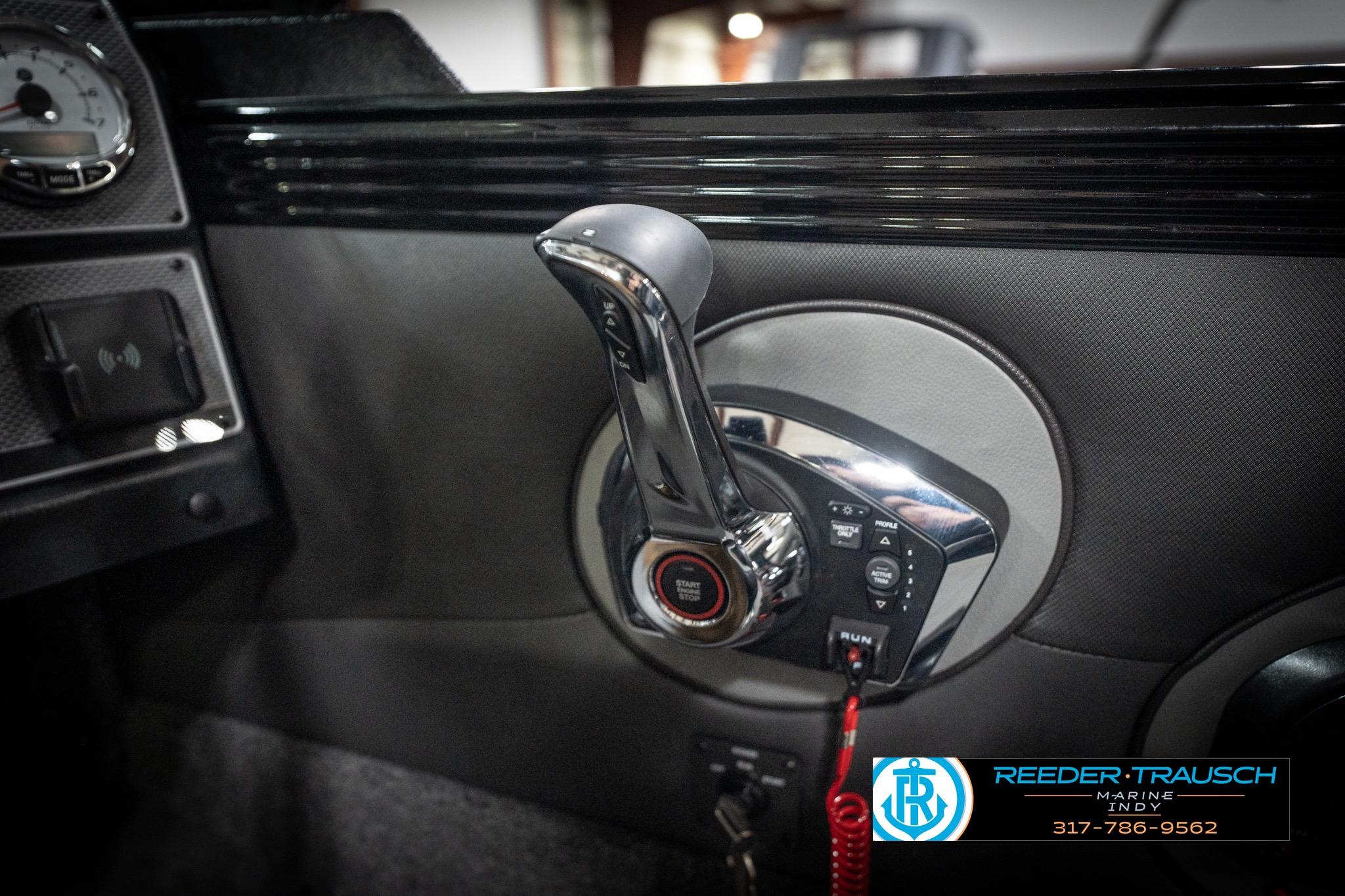 2026 Lund 2275 Baron boat dashboard with chrome throttle and control panel.