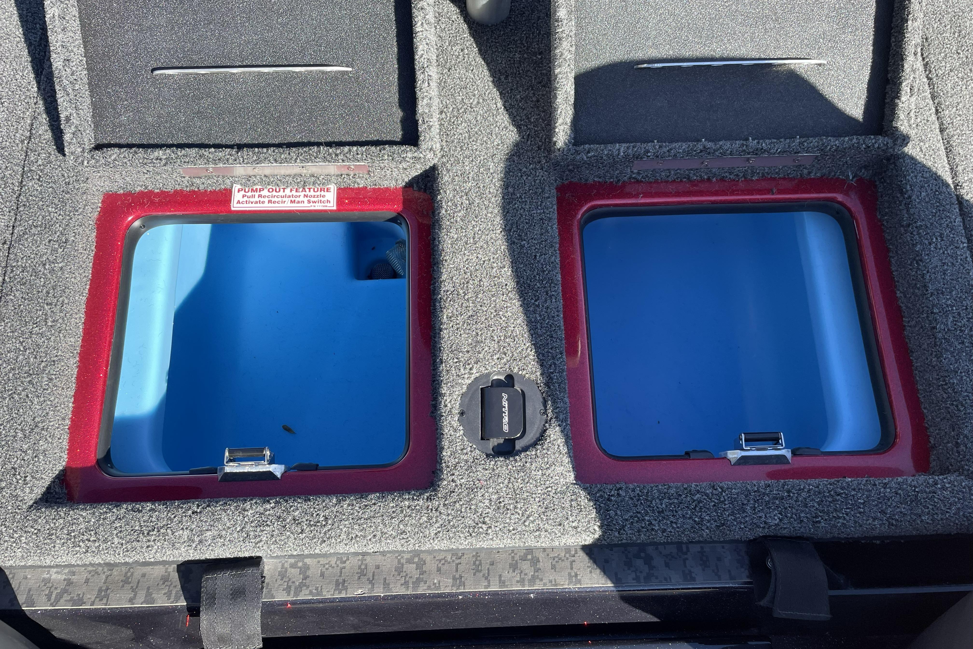 2026 Nitro Z19 XL boat storage compartments with blue interiors and pump-out feature.