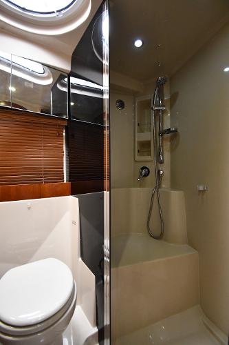 2010 Cruisers Yachts 390 Sports Coupe bathroom with modern shower and toilet.