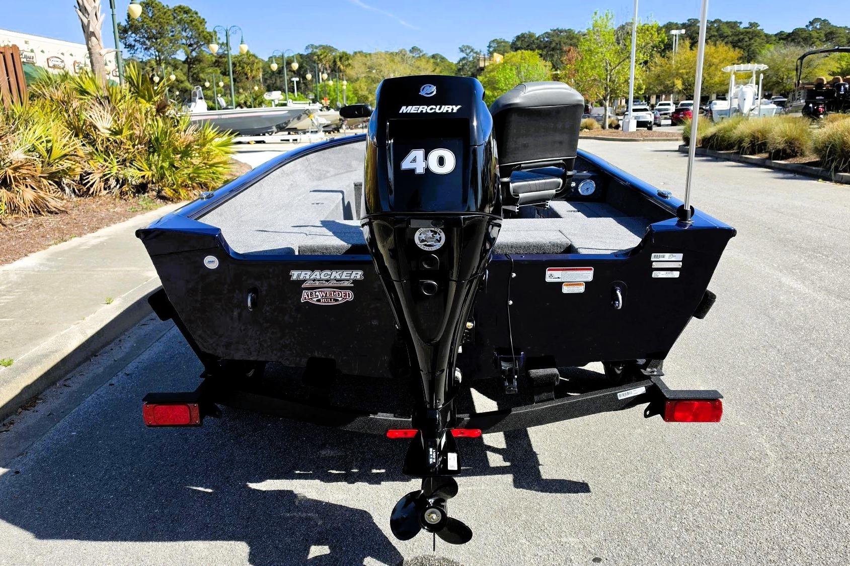 2026 Tracker Super Guide V-16 T boat with Mercury 40 outboard motor, parked outdoors.