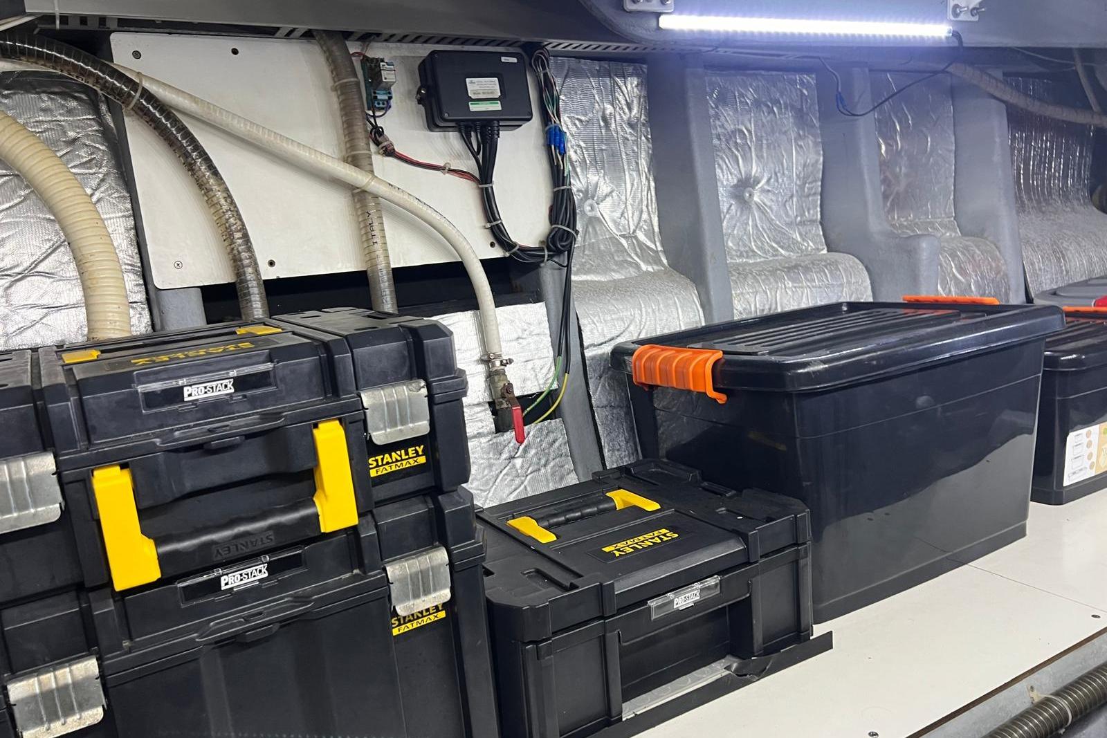 Storage area with Stanley toolboxes and equipment in a 2007 Absolute 56 yacht.