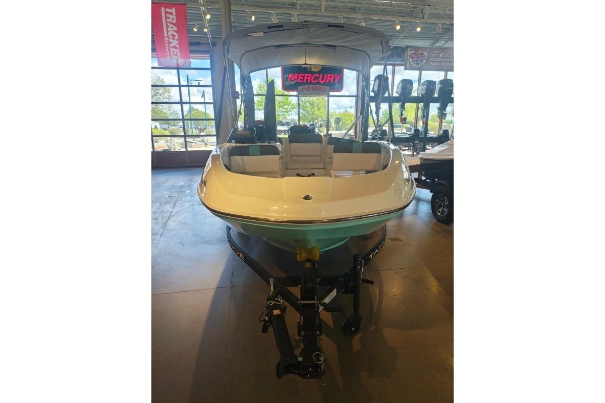 2026 Tahoe T16 boat displayed indoors, featuring sleek design and modern seating.