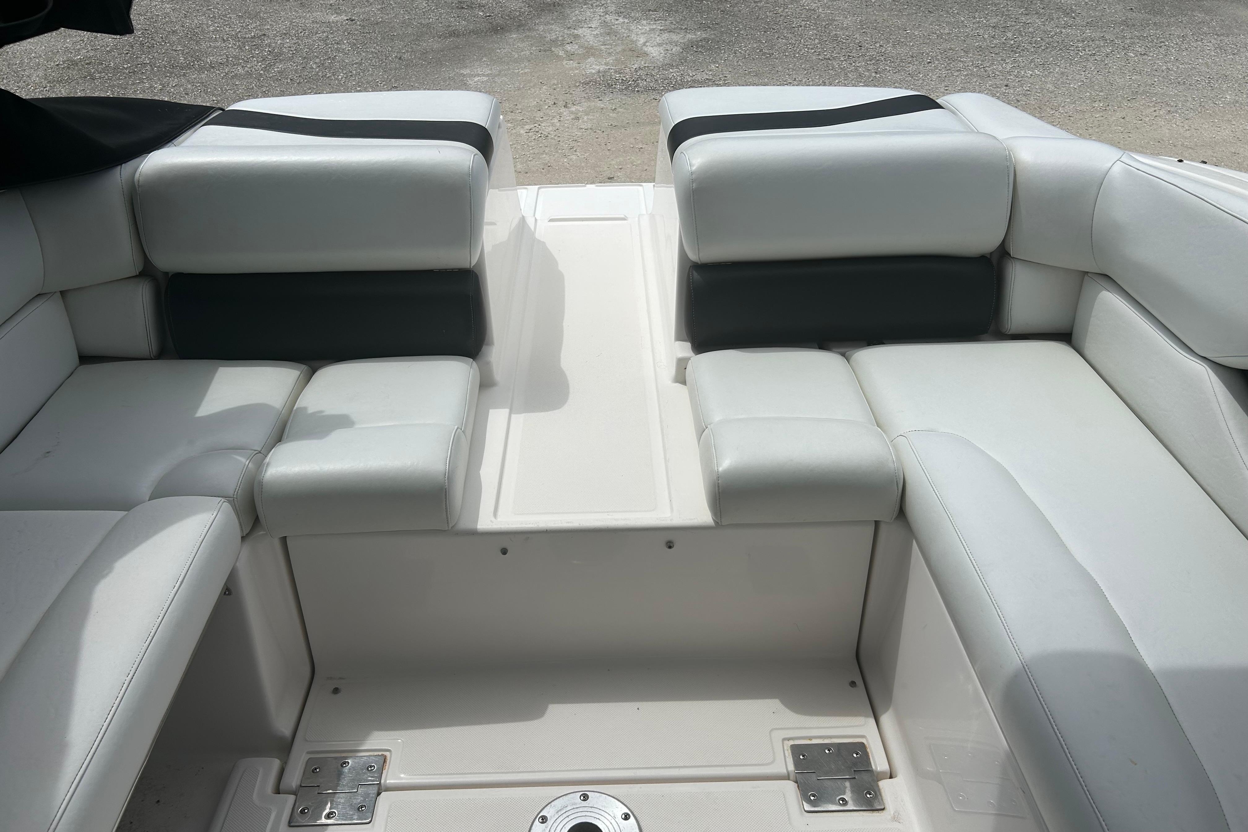 Interior seating of a 2008 Regal 2700 Bowrider boat, featuring white upholstery.