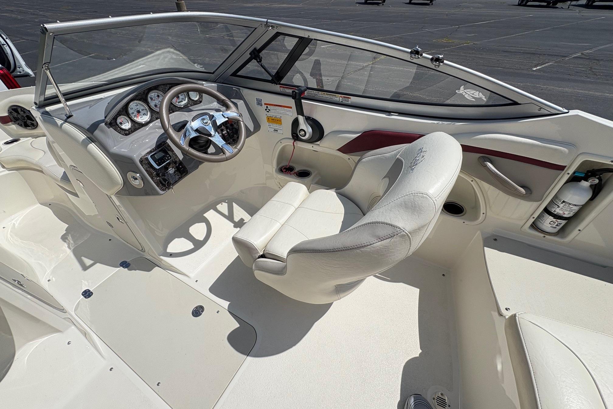 Interior of a 2013 Stingray 198 LX with white seating and dashboard.