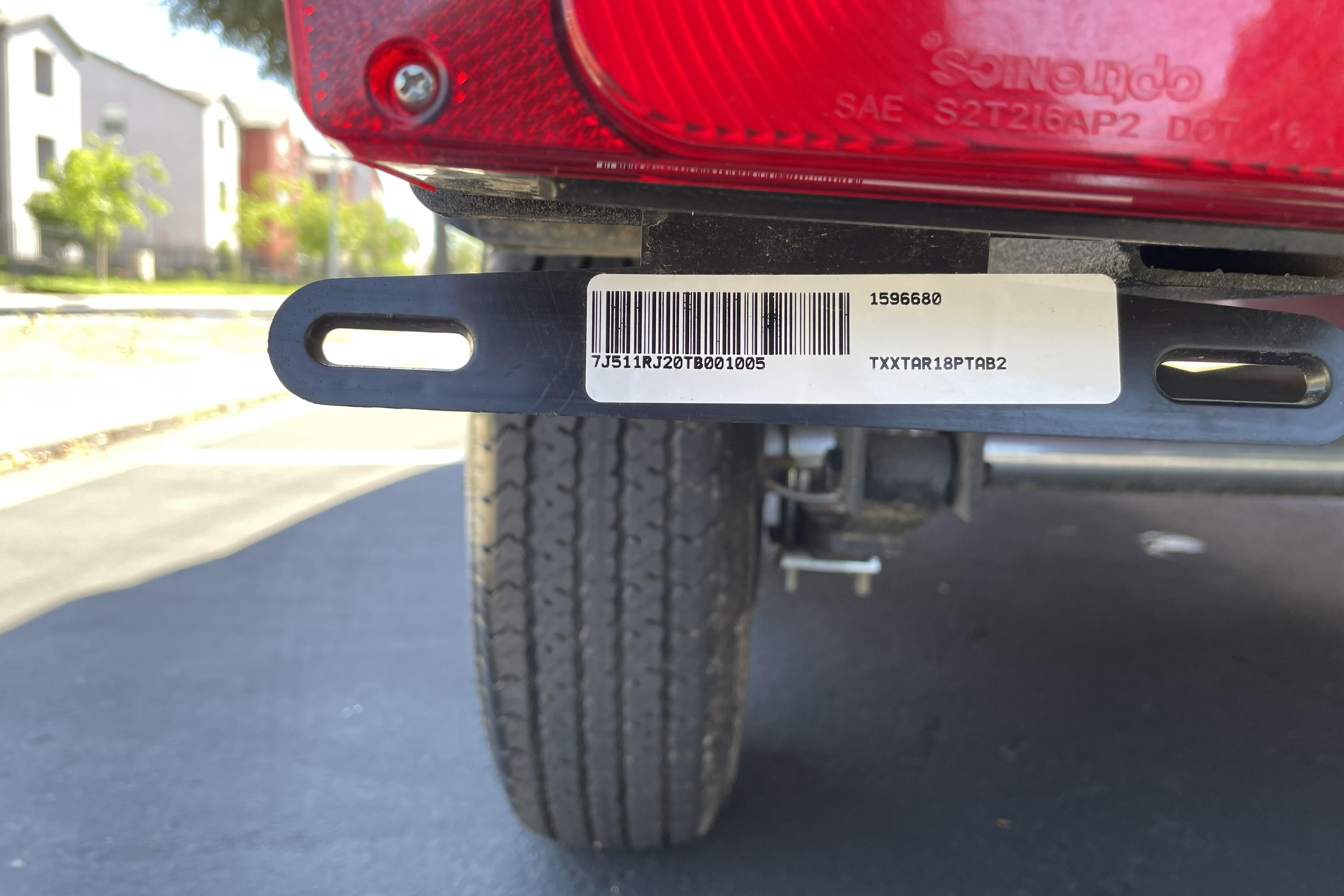 2026 Tracker Targa V-18 WT trailer with barcode and tire detail.