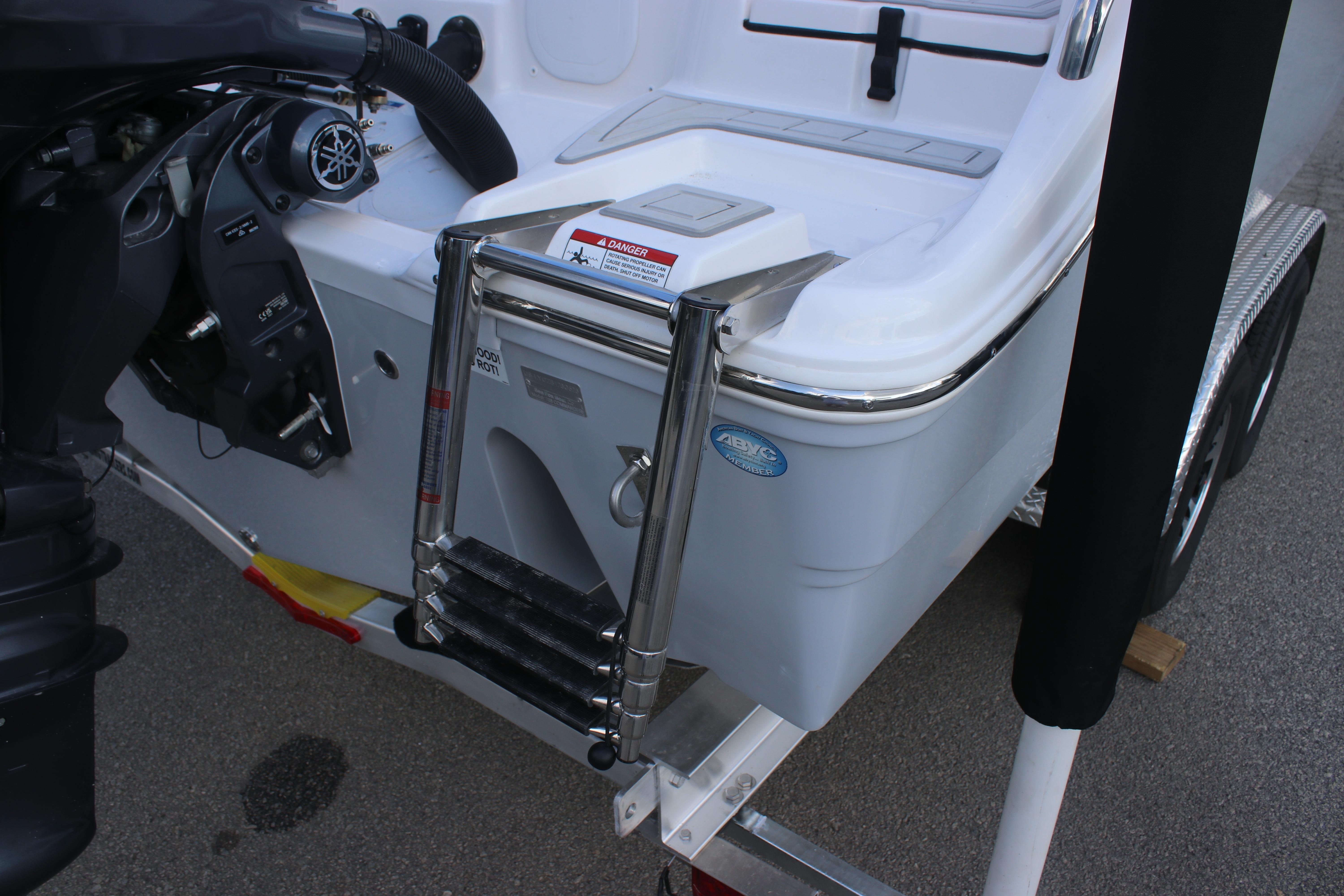 2026 Sea Fox 268 Commander boat with ladder and motor detail.