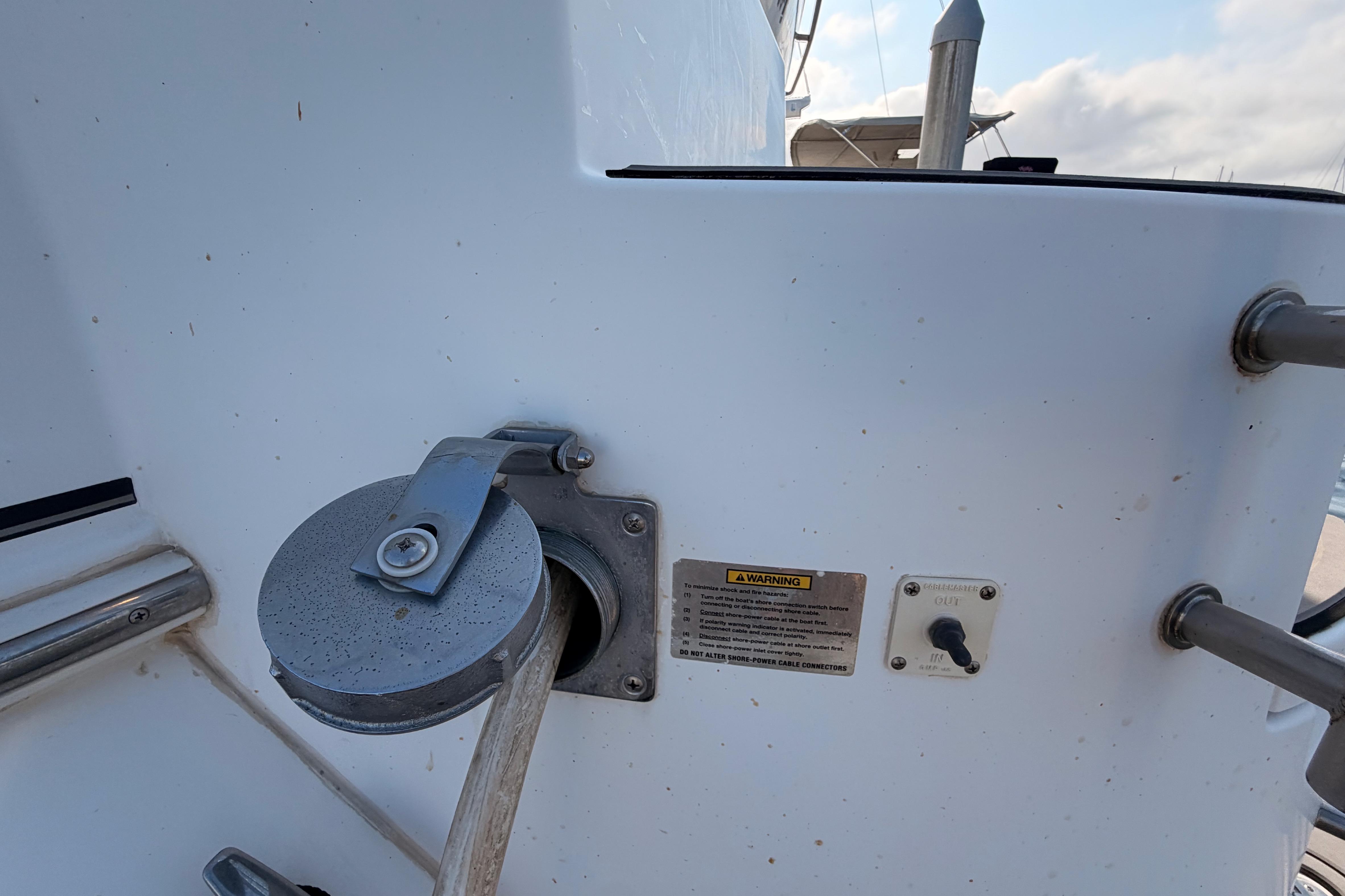 2005 Cruisers Yachts 405 Express Motoryacht power connection and warning label detail.