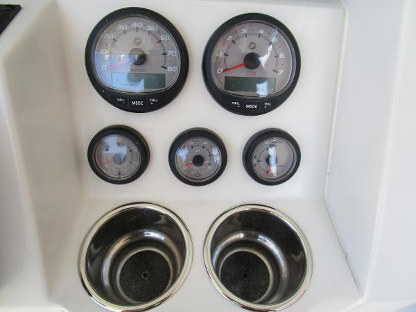 Dashboard of 2024 Ranger 2660 Bay boat with gauges and cup holders.