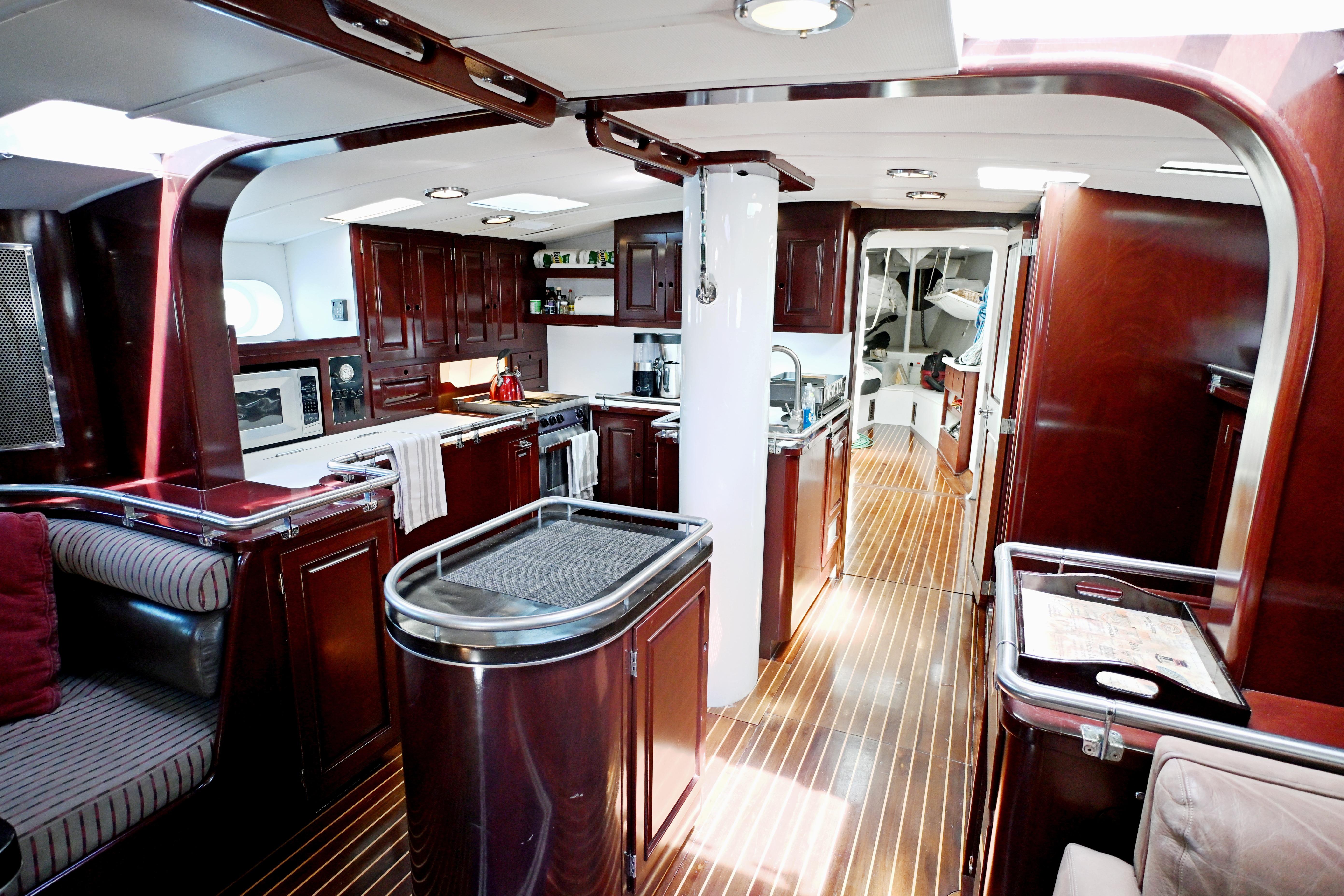 Luxurious interior of a 1968 Abeking & Rasmussen Tripp 74 yacht with elegant wood finishes.