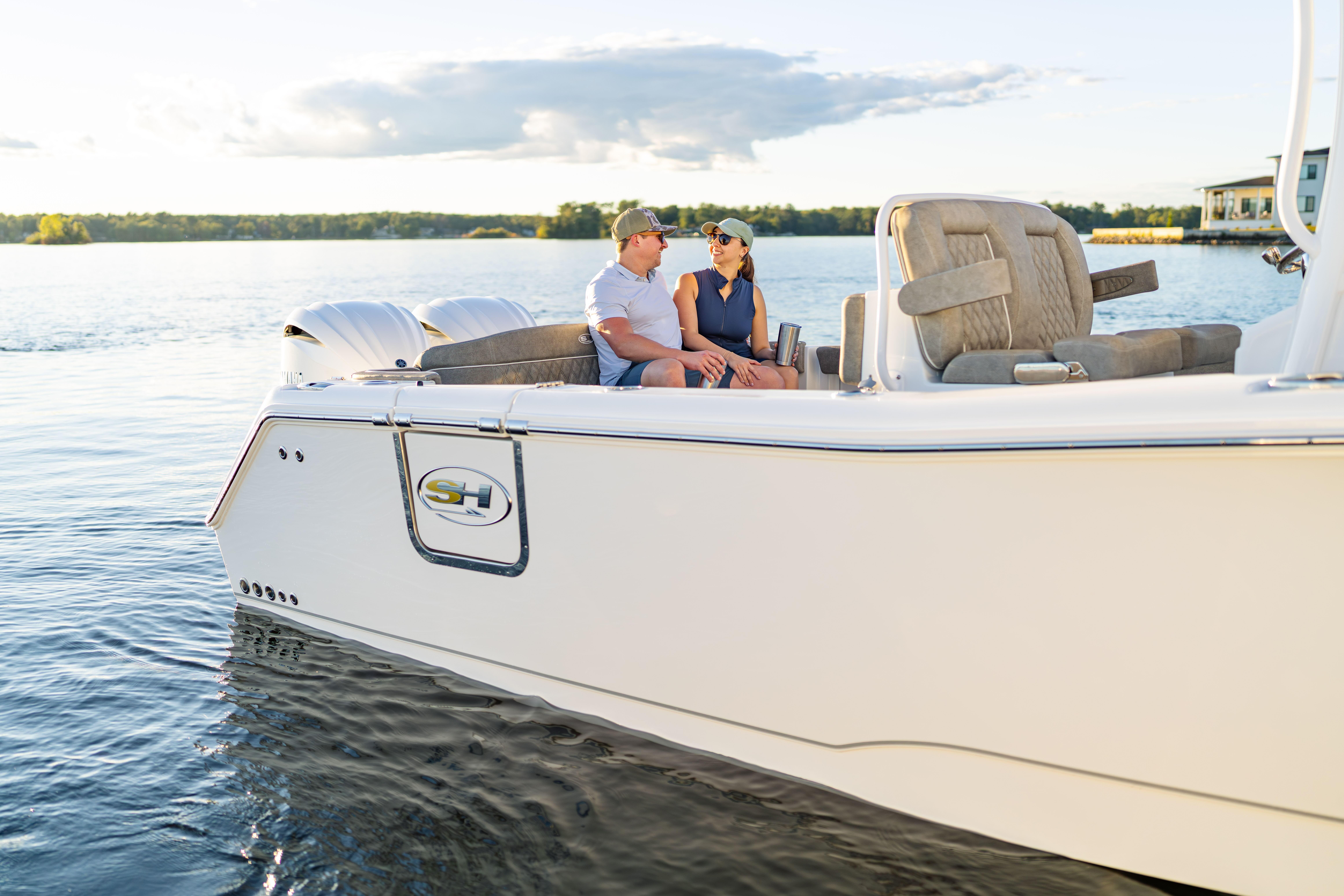 Couple enjoying a ride on a 2026 Sea Hunt Ultra 275 Coffin Box boat.