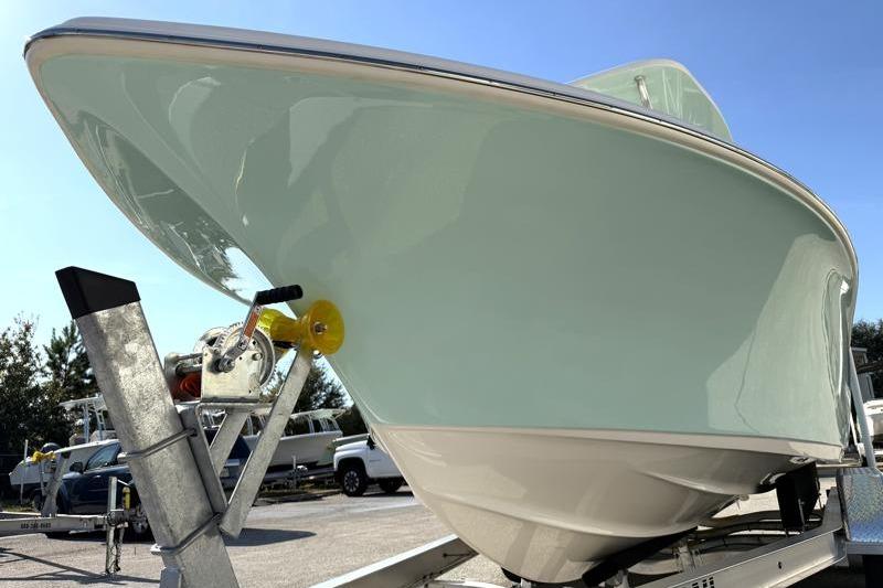 2025 Key West 239 FS boat on trailer under clear blue sky.