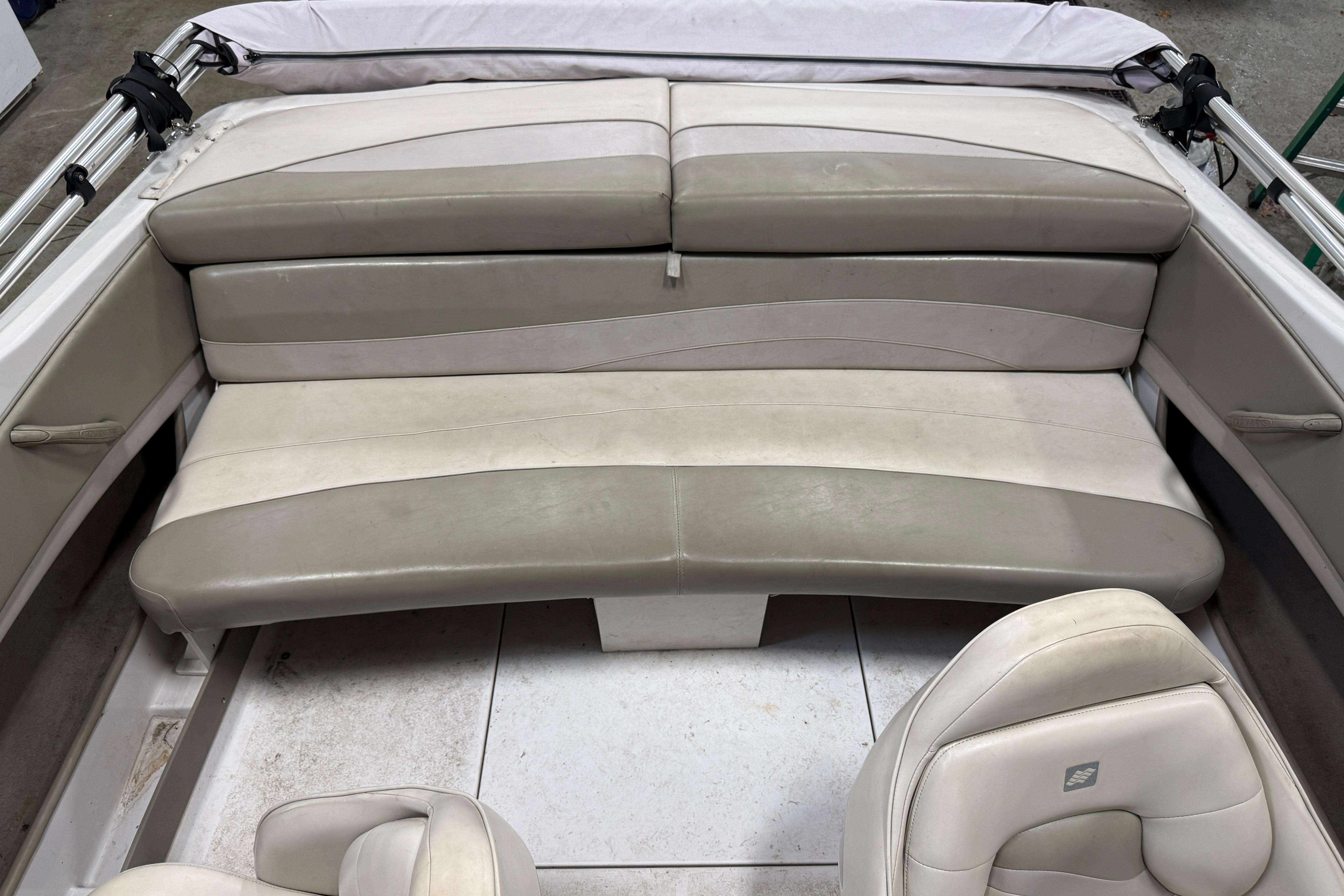 1999 Four Winns 170 Horizon LE boat interior with beige seating and white accents.