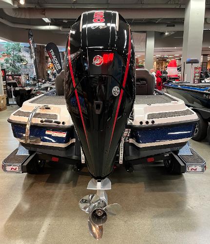 2025 Nitro Z20 XL Pro boat with powerful outboard motor displayed indoors.
