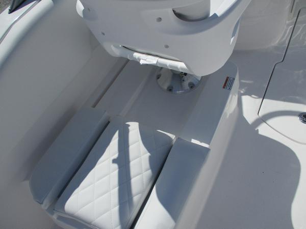 2025 Sea Fox 228 Traveler boat seat with white cushioned upholstery.