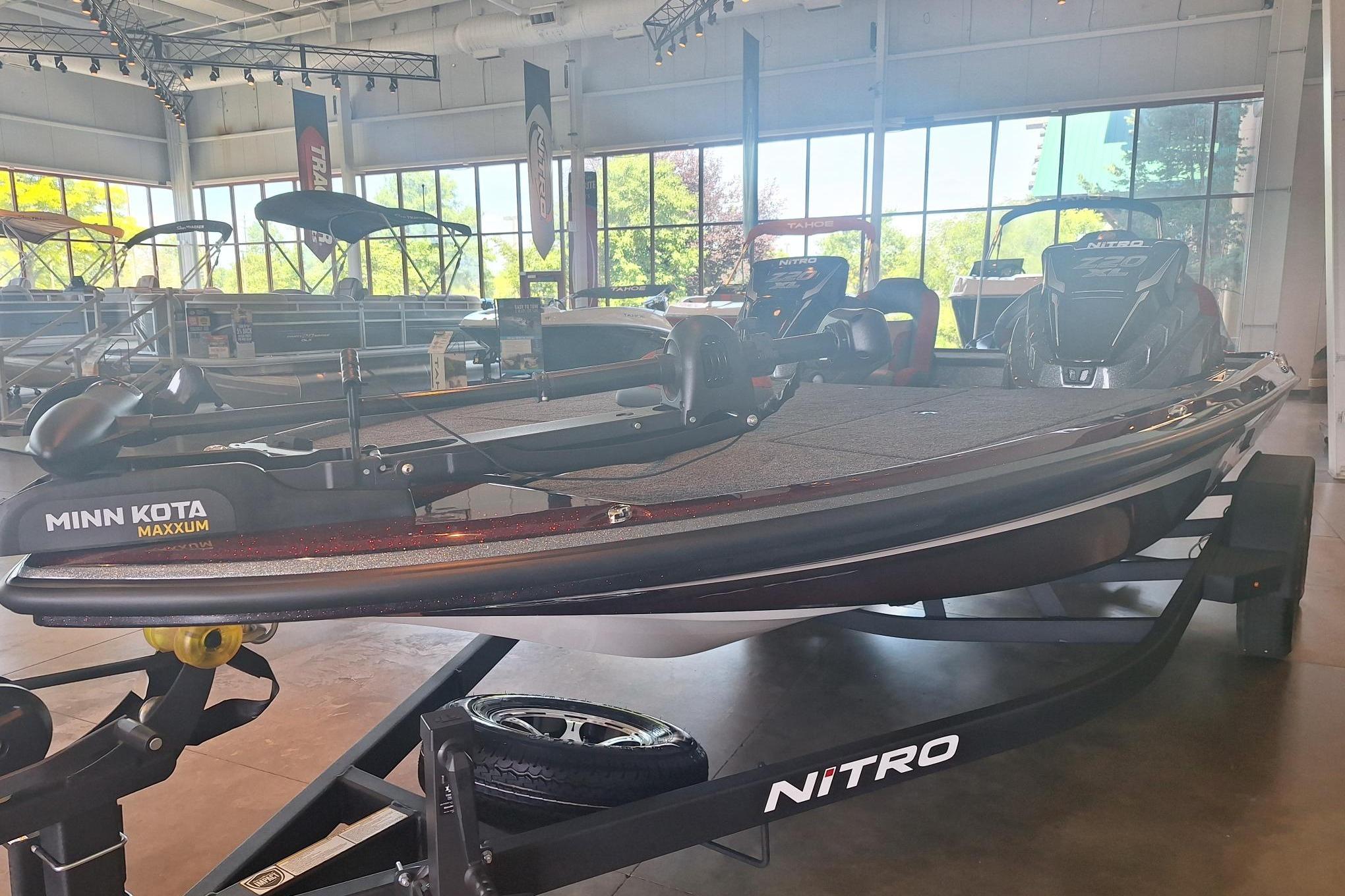 2026 Nitro Z20 XL boat displayed indoors with Minn Kota Maxxum trolling motor.