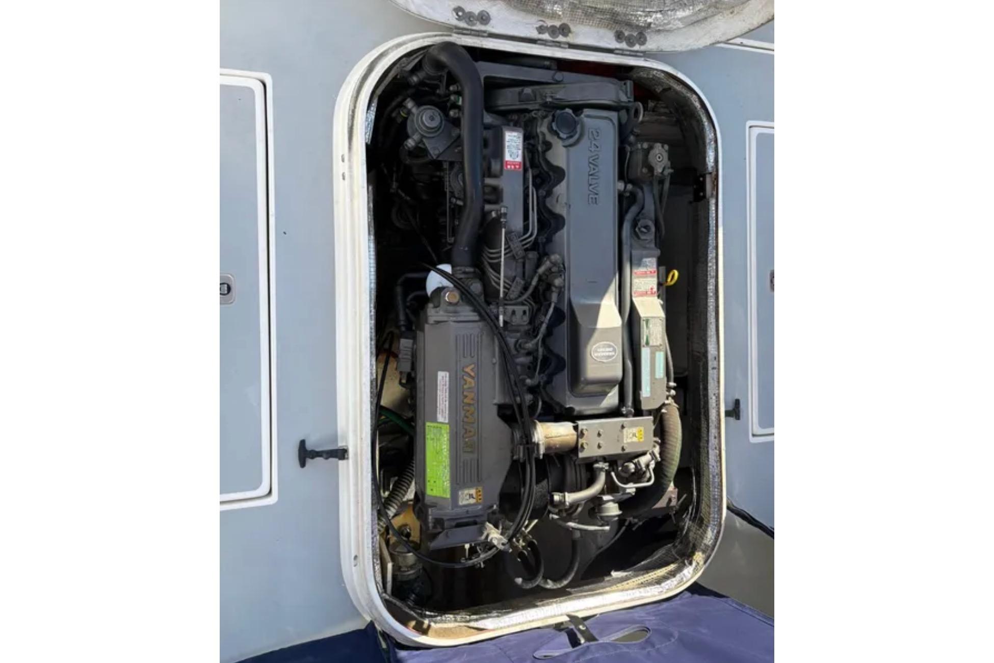 Engine compartment of a 2005 Albin 28 Tournament Express boat, featuring a Yanmar engine.