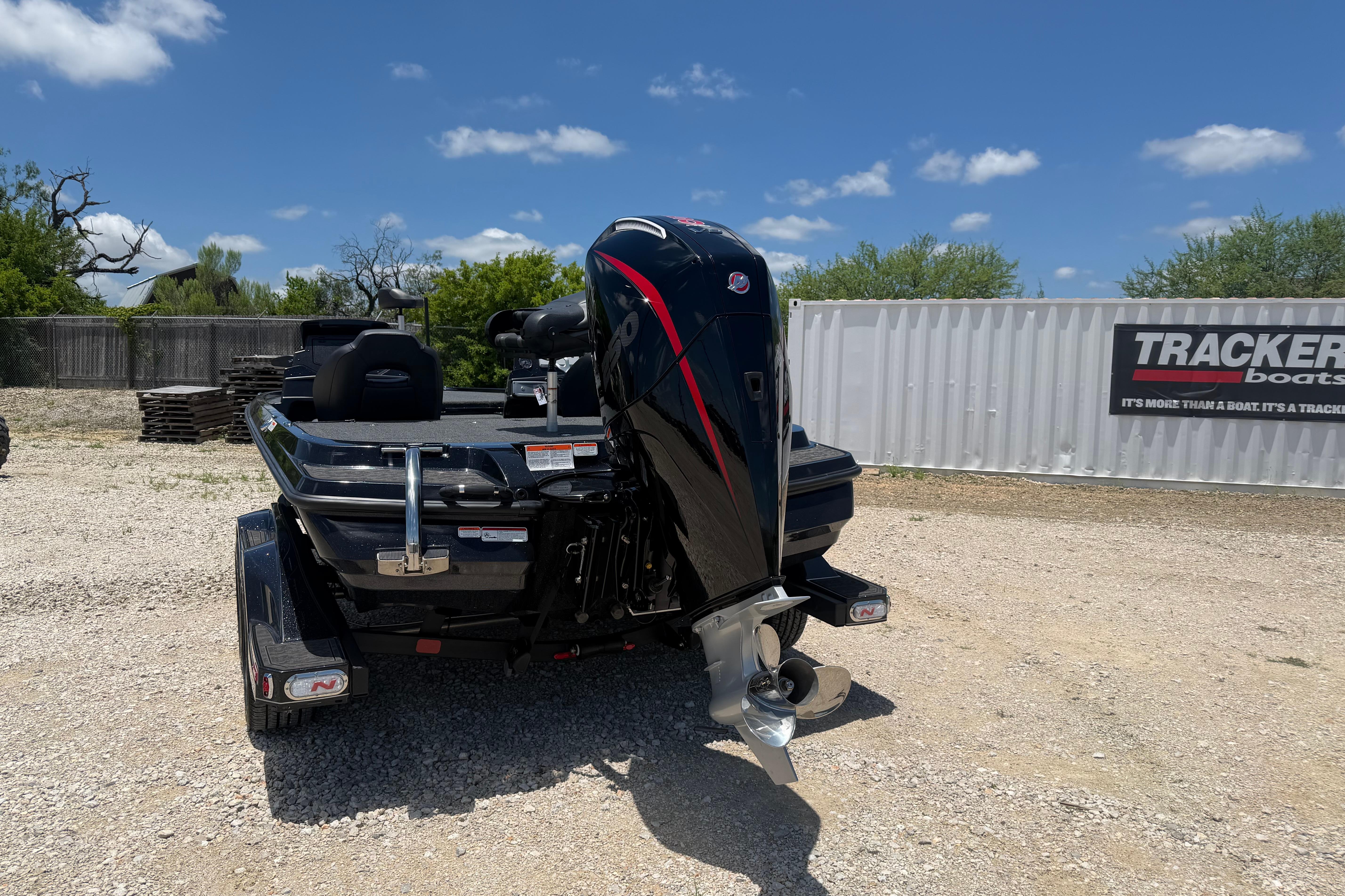 2026 Nitro Z20 XL Pro boat with powerful outboard motor, parked outdoors.