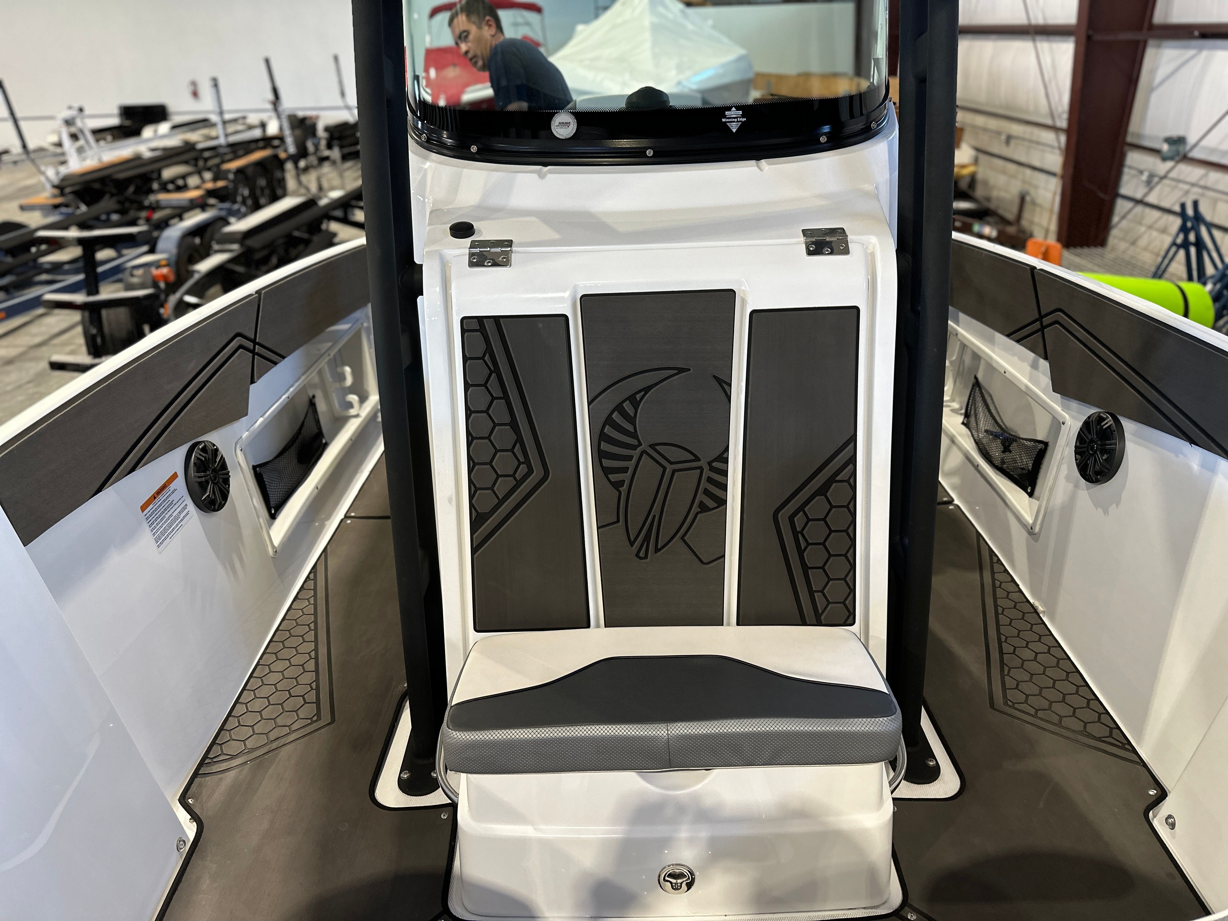 The image shows the cockpit of a 2021 Scarab 255 Open ID boat with modern detailing.