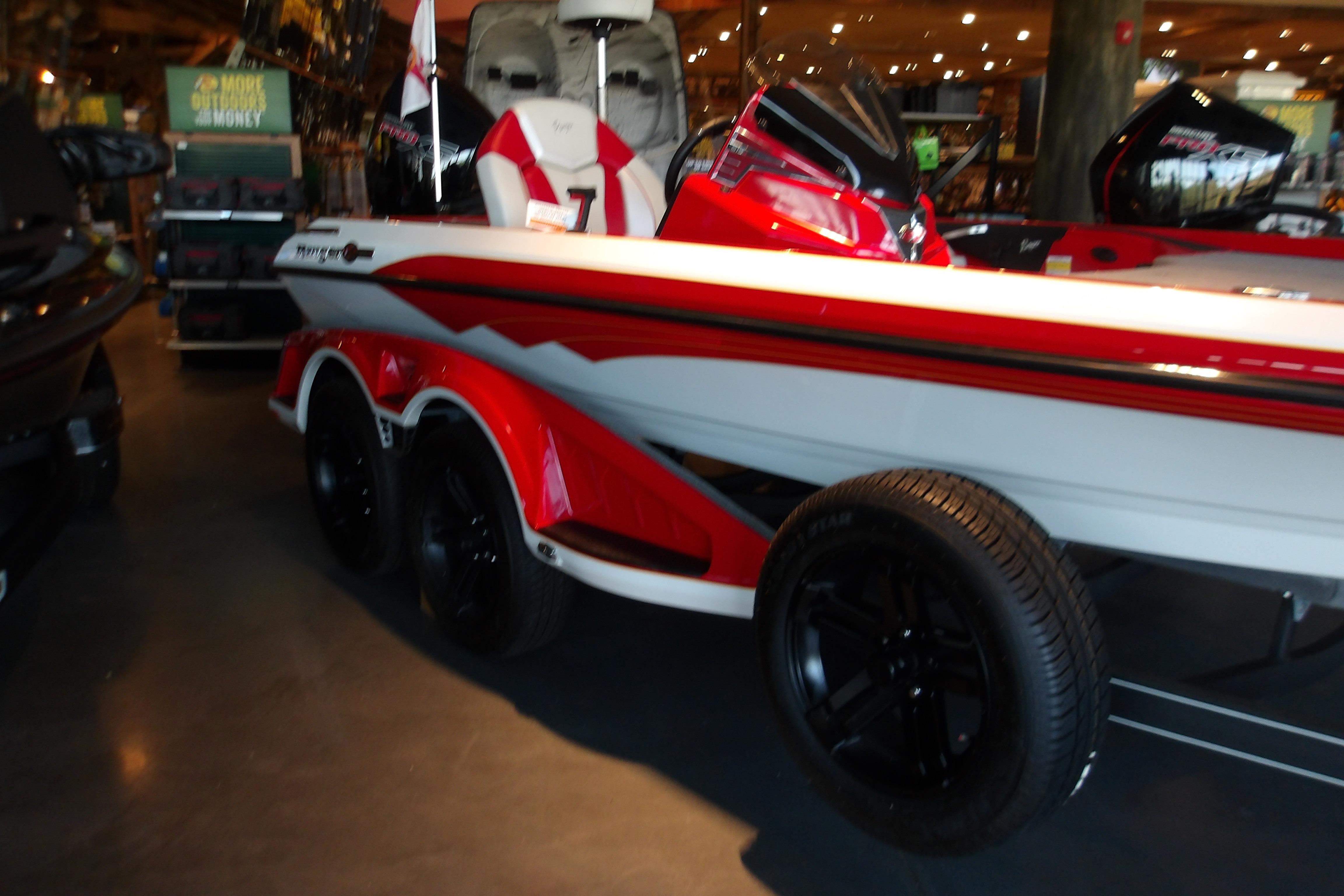 2025 Ranger Z519R Cup-Equipped boat in showroom, featuring sleek red and white design.