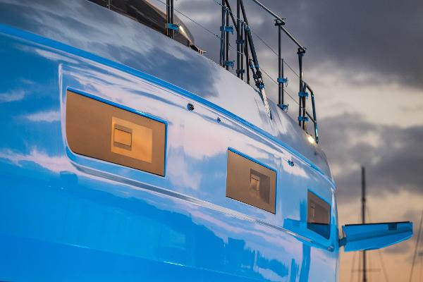 2025 Lagoon 60 yacht with sleek blue hull and modern design.