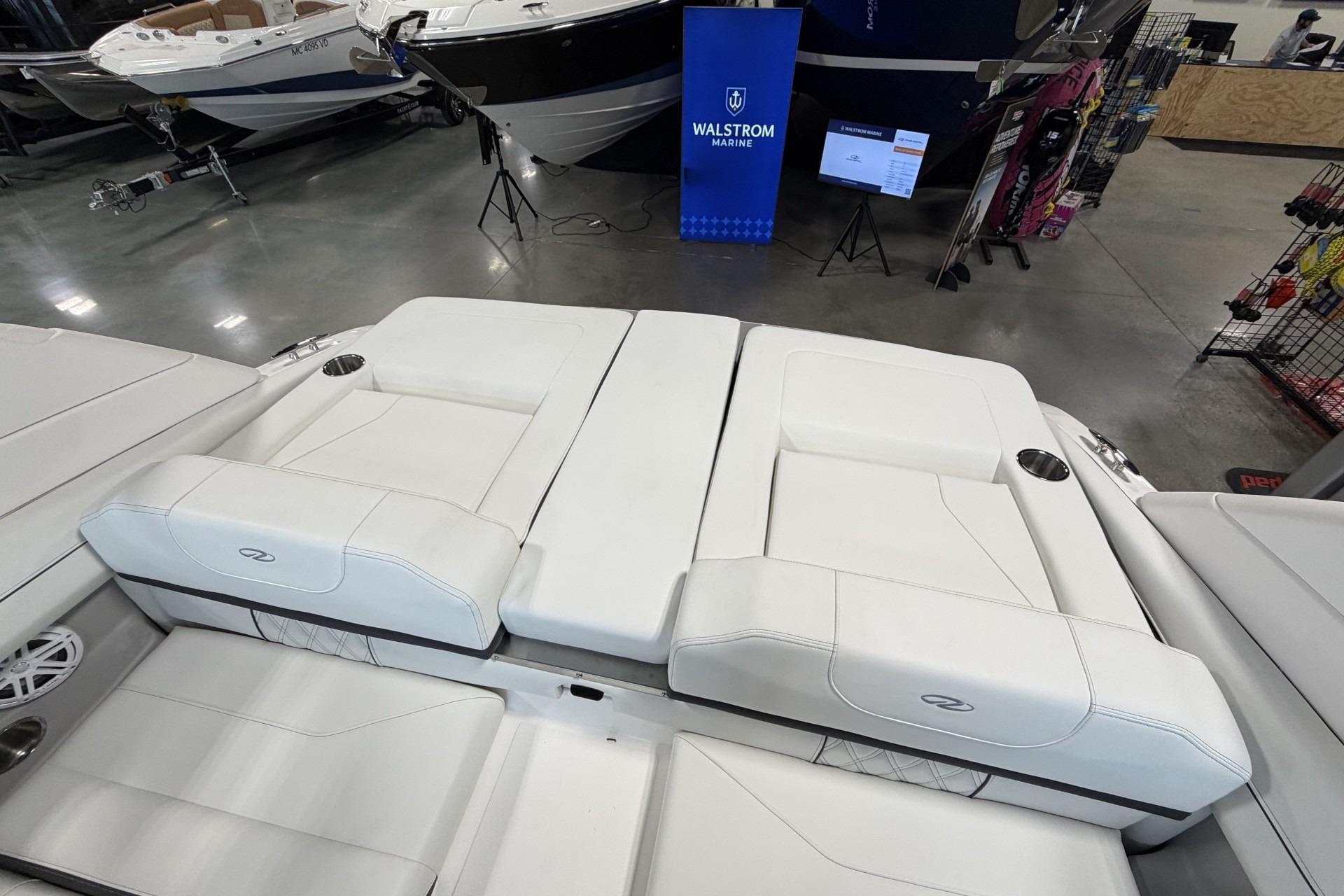 2027 Regal LS2 boat interior with white seating at Walstrom Marine showroom.